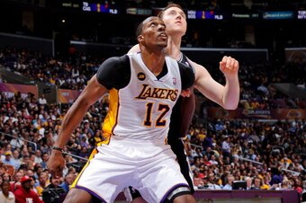 LOS ANGELES, CA - APRIL 28: Dwight Howard #12 of the Los Angeles Lakers battles for rebound position against Aron Baynes #16 of the San Antonio Spurs in Game Four of the Western Conference Quarterfinals during the 2013 NBA Playoffs at Staples Center on Ap