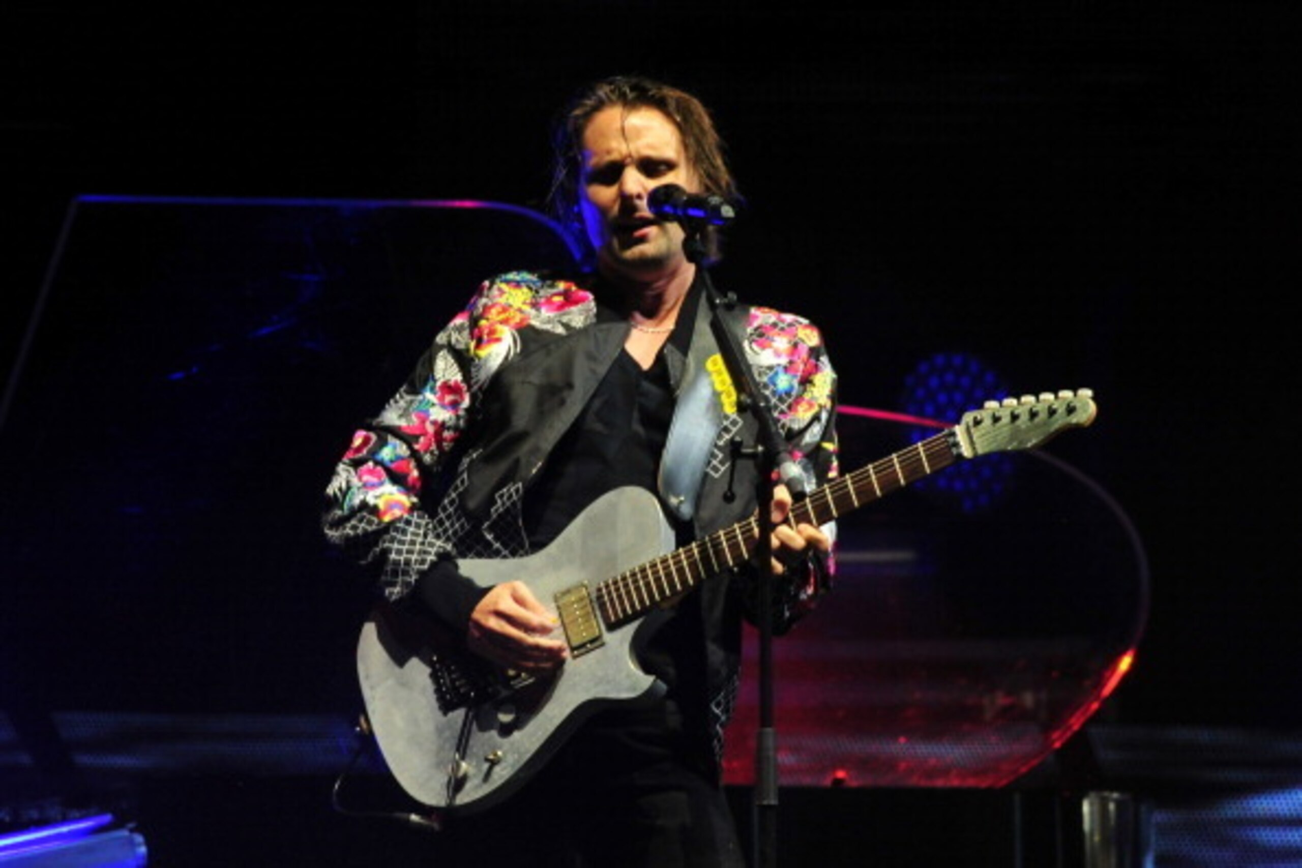 INDIO, CA - APRIL 19:  Musician Matthew Bellamy of Muse performs onstage during day 2 of the 2014 Coachella Valley Music & Arts Festival at the Empire Polo Club on April 19, 2014 in Indio, California.  (Photo by Frazer Harrison/Getty Images for Coachella)