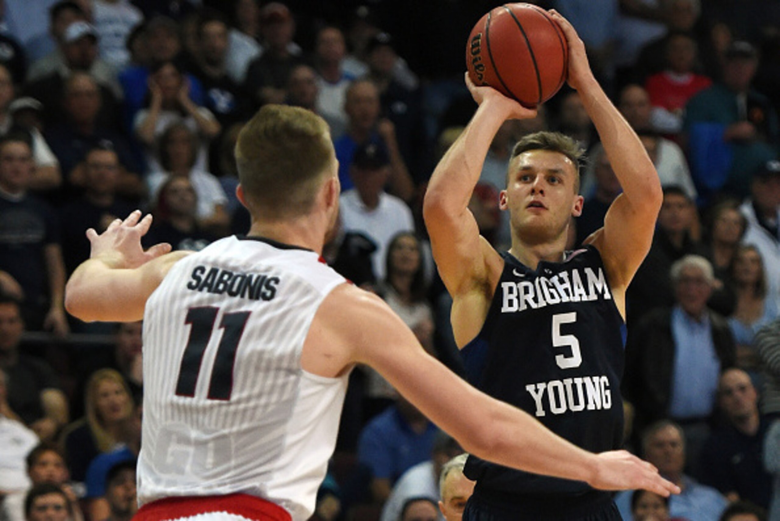 LAS VEGAS, NV - MARCH 07:  Kyle Collinsworth #5 of the Brigham Young Cougars shoots against Domantas Sabonis #11 of the Gonzaga Bulldogs during a semifinal game of the West Coast Conference Basketball tournament at the Orleans Arena on March 7, 2016 in La