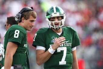 ORLANDO, FL - JANUARY 1: Brian Hoyer #7 of the Michigan State Spartans talks with backup quarterback Kirk Cousins #8 during the game against the Georgia Bulldogs in the Capital One Bowl at the Citrus Bowl on January 1, 2009 in Orlando, Florida. The Bulldo