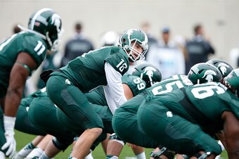 EAST LANSING, MI - OCTOBER 3: Connor Cook #18 of the Michigan State Spartans directs the offense during a game against the Purdue Boilermakers at Spartan Stadium on October 3, 2015 in East Lansing, Michigan. The Spartans defeated the Boilermakers 24-21. (