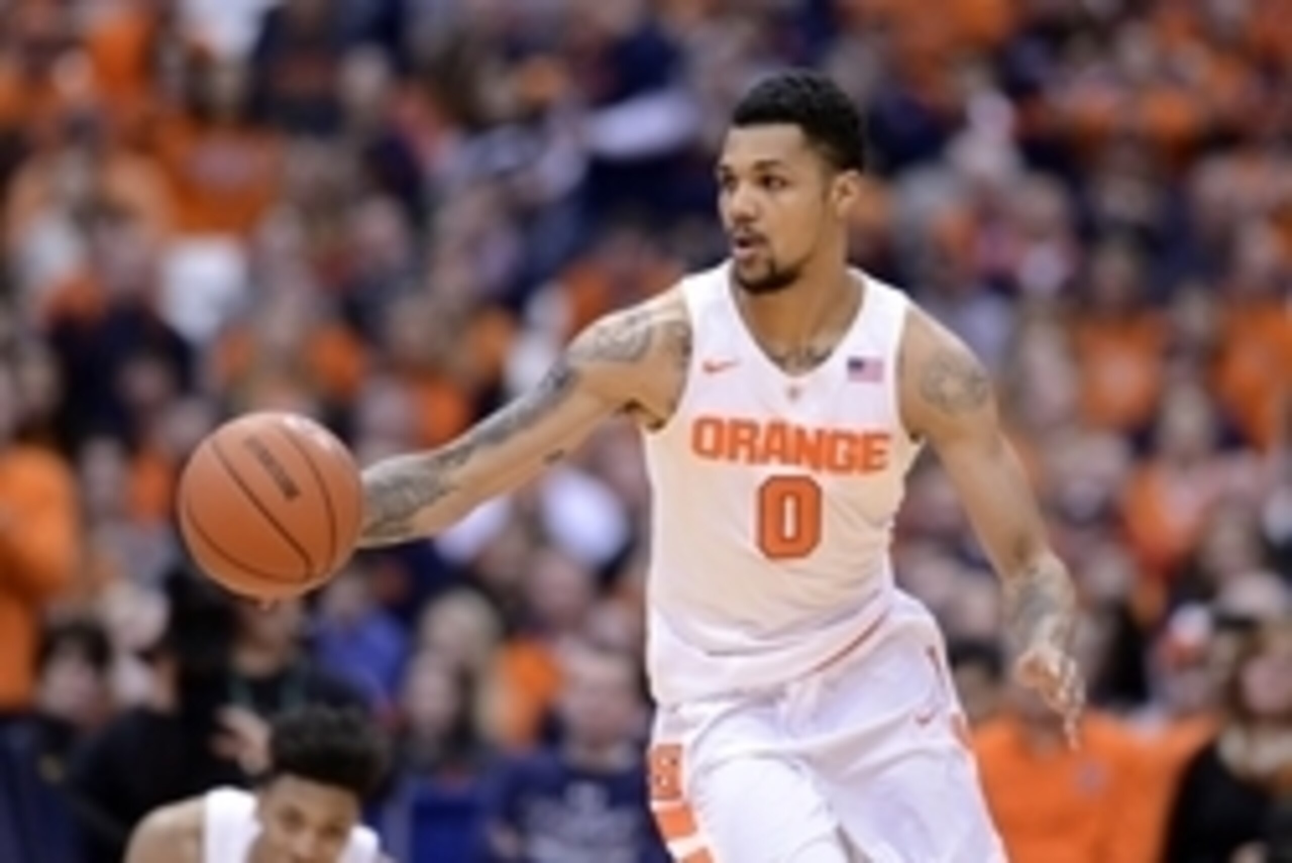 Feb 11, 2016; Syracuse, NY, USA; Syracuse Orange forward Michael Gbinije (0) brings the ball up court during the second half of a game against the Florida State Seminoles  at the Carrier Dome.Syracuse won  85-72. Mandatory Credit: Mark Konezny-USA TODAY S