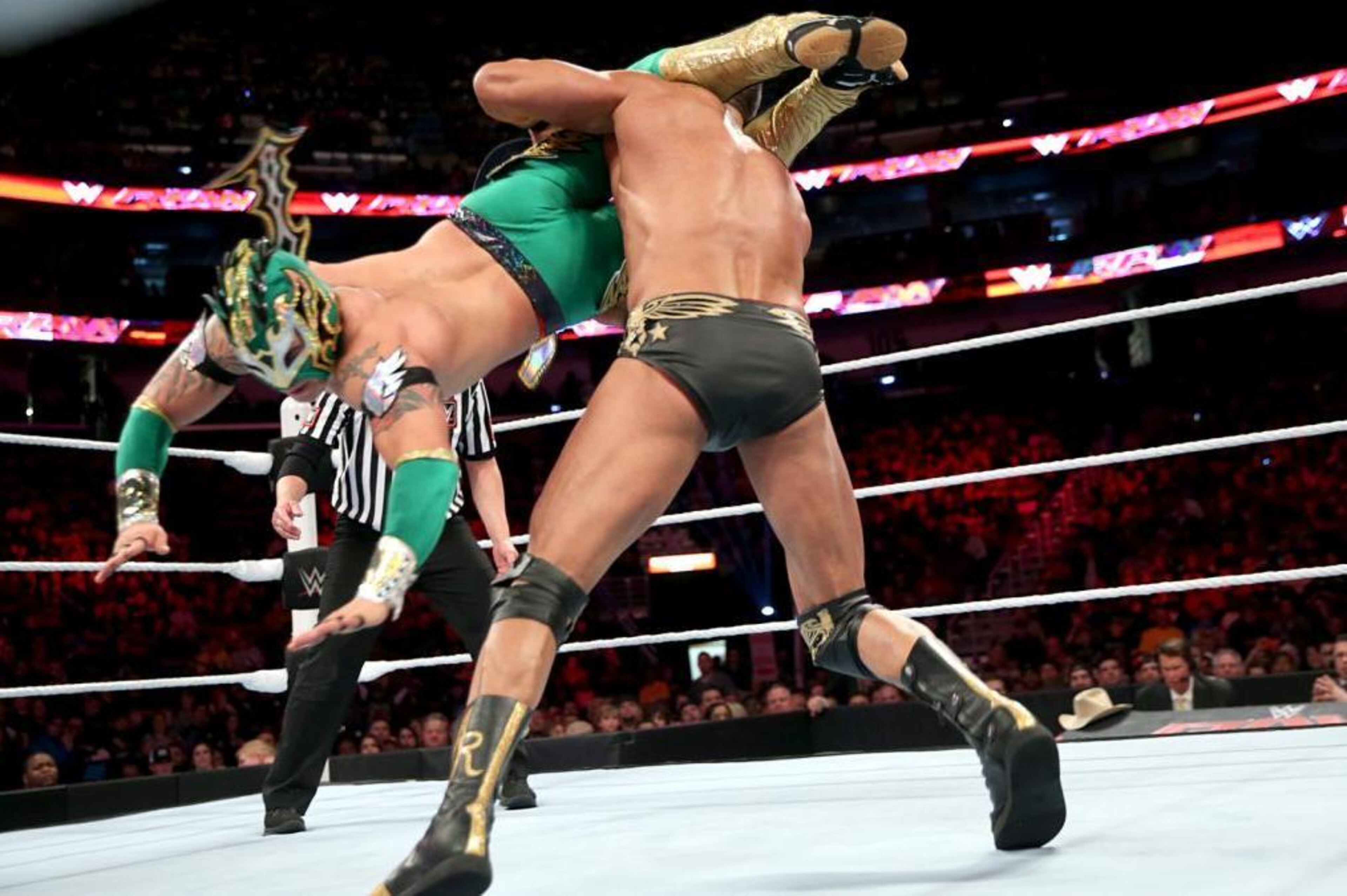 Kalisto flips Alberto Del Rio over with a leg scissors takedown. Kalisto flips Alberto Del Rio over with a leg scissors takedown.
