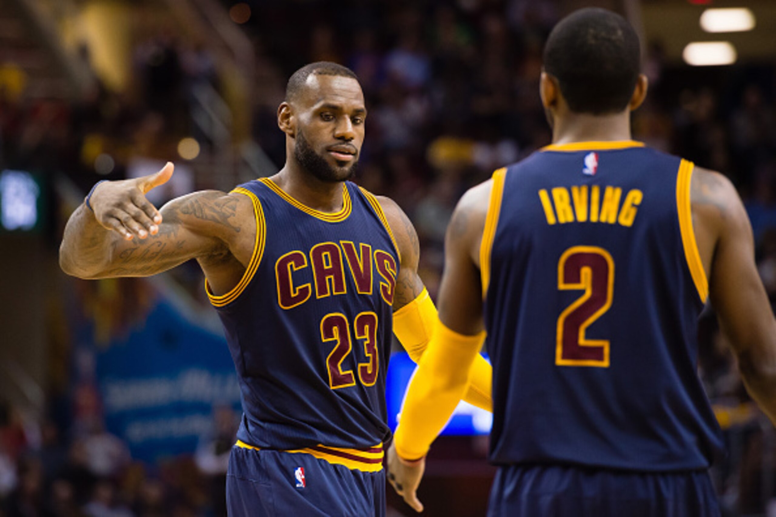 CLEVELAND, OH - MARCH 23: LeBron James #23 celebrates with Kyrie Irving #2 of the Cleveland Cavaliers after scoring during the second half against the Milwaukee Bucks at Quicken Loans Arena on March 23, 2016 in Cleveland, Ohio. The Cavaliers defeated the 