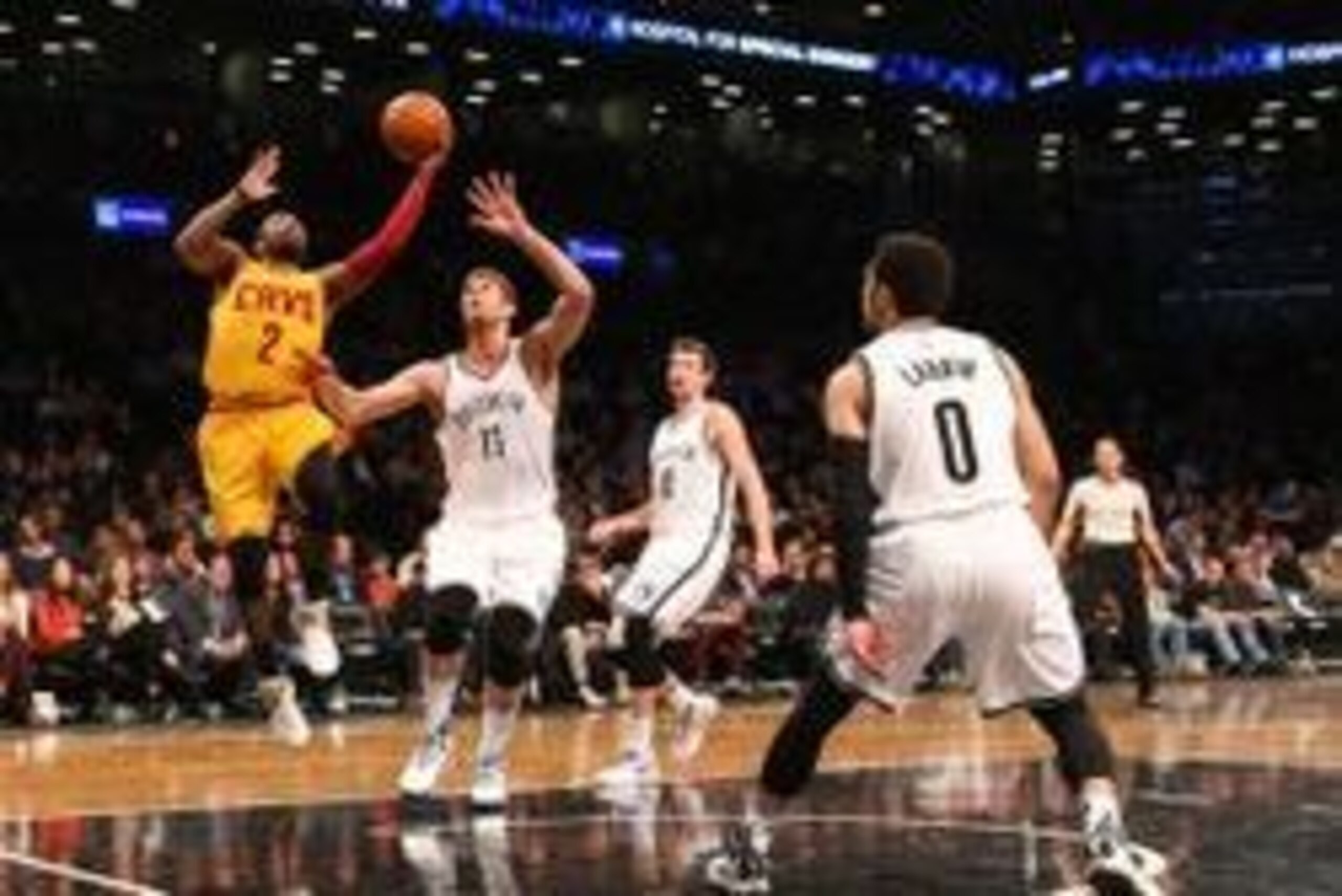 Mar 24, 2016; Brooklyn, NY, USA; Cleveland Cavaliers guard Kyrie Irving (2) shoots over Brooklyn Nets center Brook Lopez (11) during the first quarter at Barclays Center. Mandatory Credit: Anthony Gruppuso-USA TODAY Sports