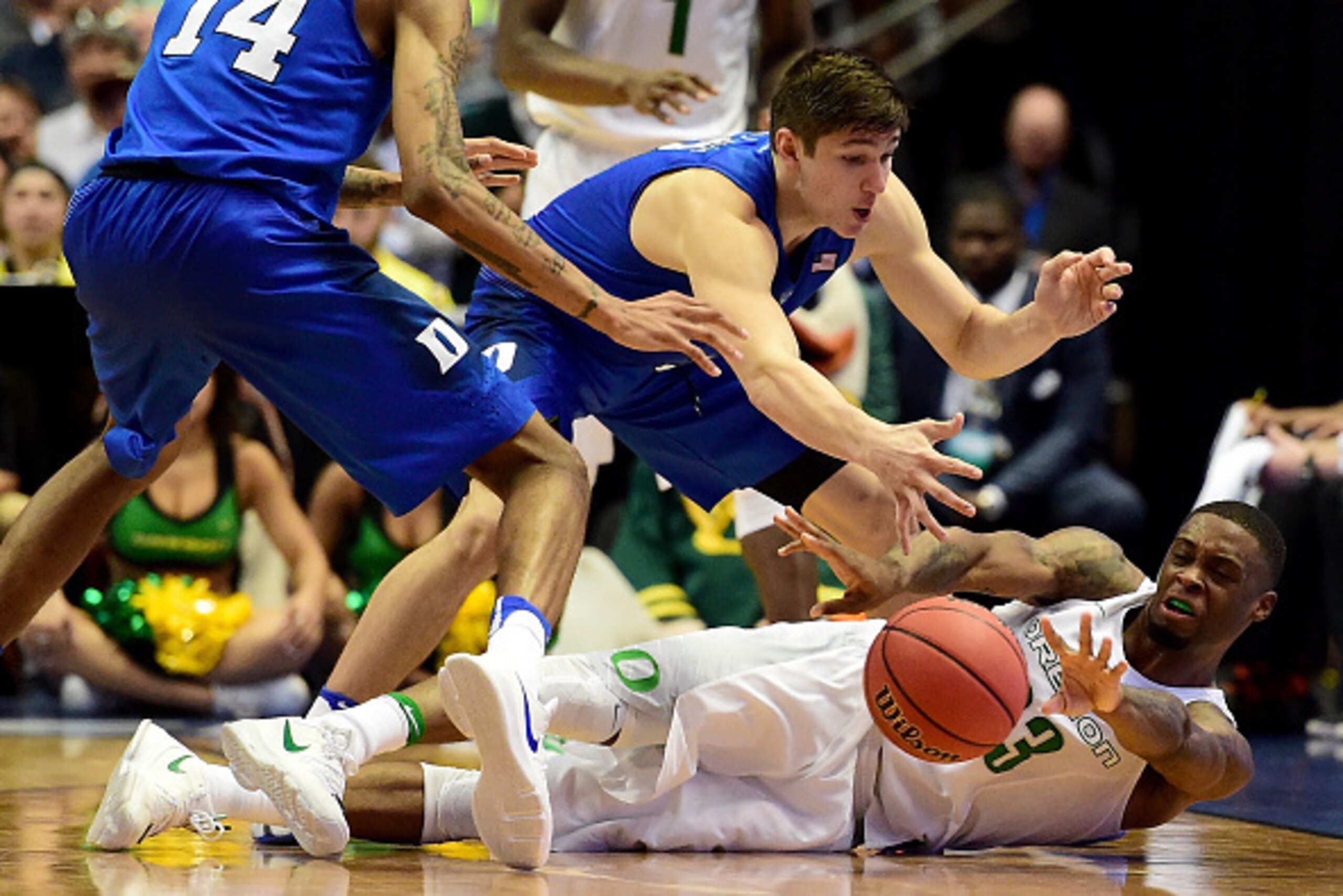 ANAHEIM, CA - MARCH 24:  Elgin Cook #23 of the Oregon Ducks dives on the ball against Grayson Allen #3 of the Duke Blue Devils in the second half in the 2016 NCAA Men's Basketball Tournament West Regional at the Honda Center on March 24, 2016 in Anaheim, 
