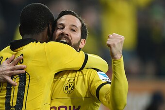 Dortmund's Columbian striker Adrian Ramos (L) and Dortmund's midfielder Gonzalo Castro celebrate after scoring the second goal for Dortmund during the German Bundesliga first division football match between FC Augsburg vs Borussia Dortmund in Augsburg, so