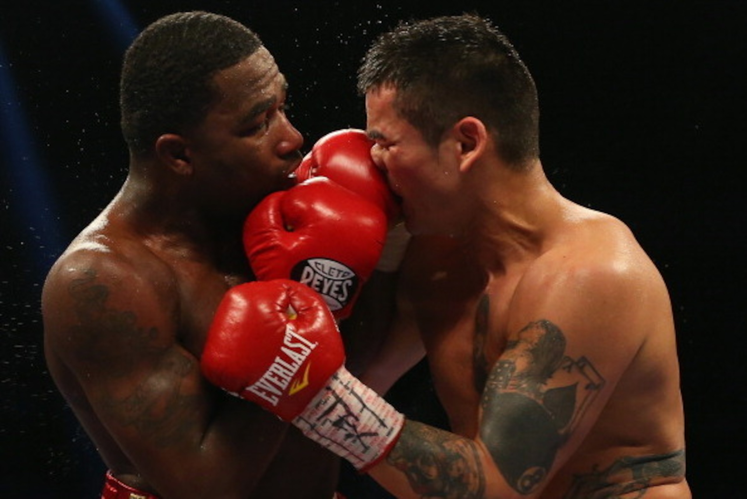SAN ANTONIO, TX - DECEMBER 14:  (L-R) Adrien Broner and Marcos Maidana during their WBA Welterweight Title bout at Alamodome on December14, 2013 in San Antonio, Texas..  (Photo by Ronald Martinez/Getty Images)