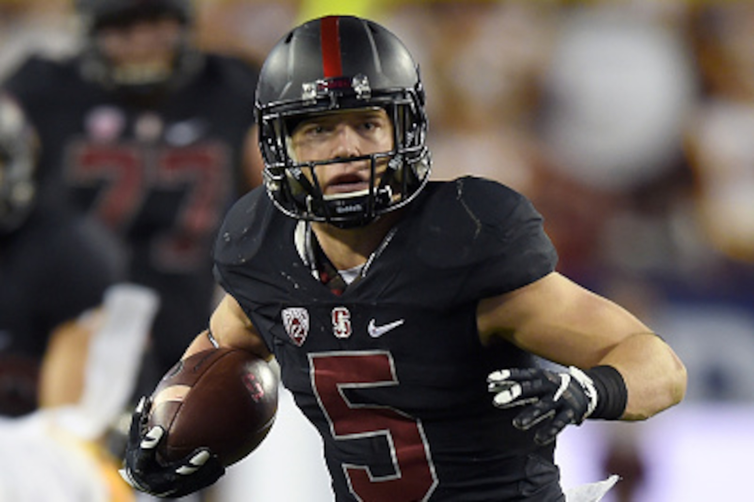 SANTA CLARA, CA - DECEMBER 05:  Christian McCaffrey #5 of the Stanford Cardinal rushes with the ball against the USC Trojans during the first quarter of the NCAA Pac-12 Championship game at Levi's Stadium on December 5, 2015 in Santa Clara, California.  (