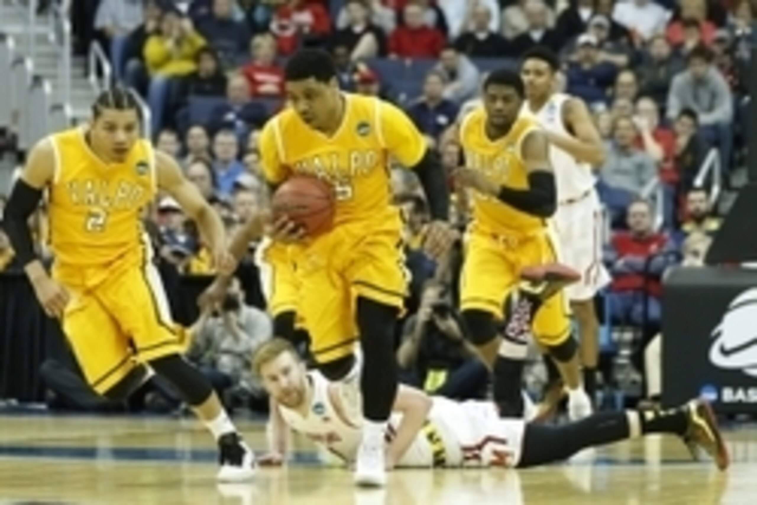 Mar 20, 2015; Columbus, OH, USA; Valparaiso Crusaders guard Darien Walker (5) brings the ball up court as Maryland Terrapins forward Evan Smotrycz (1) lays on the court during the first half in the second round of the 2015 NCAA Tournament at Nationwide Ar
