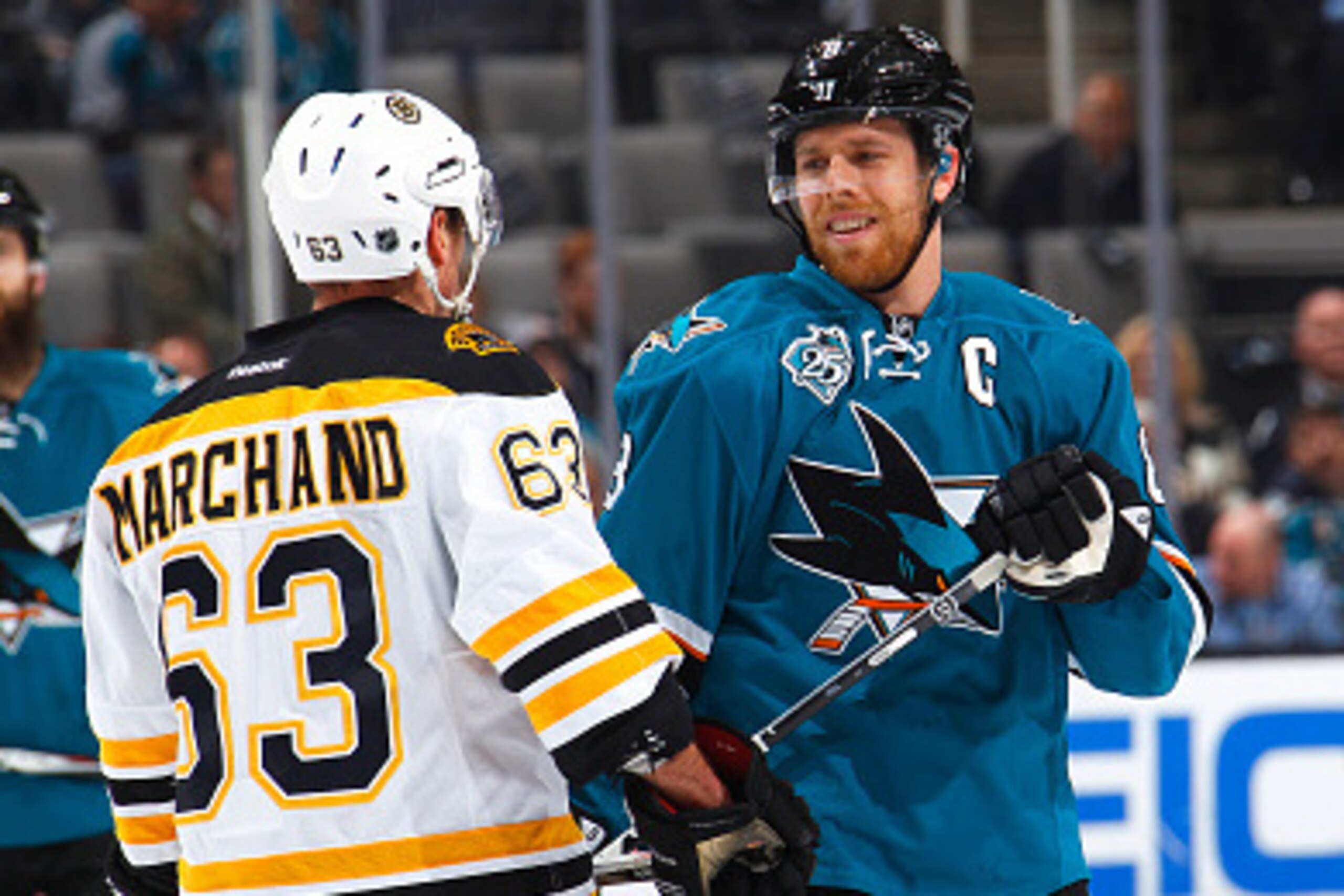 SAN JOSE, CA - MARCH 15: Brad Marchand #63 of the Boston Bruins skates up to Joe Pavelski #8 of the San Jose Sharks at SAP Center on March 15, 2016 in San Jose, California. (Photo by Rocky W. Widner/NHL/Getty Images)
