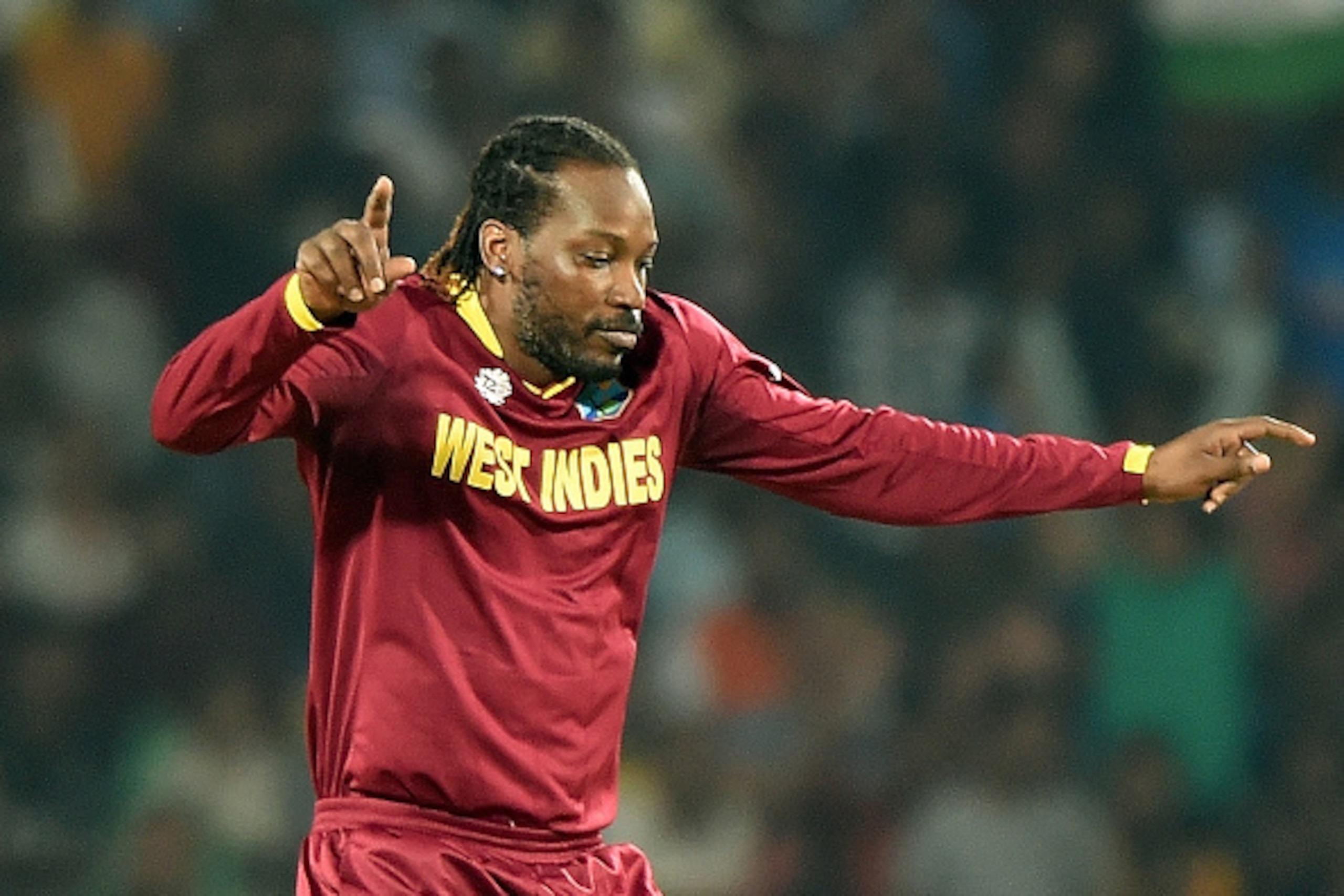 West Indies's Chris Gayle celebrates after taking the wicket of South Africa's batsman Rilee Rossouw during the World T20 cricket tournament match between South Africa and West Indies at The Vidarbha Cricket Association Stadium in Nagpur on March 25, 2016