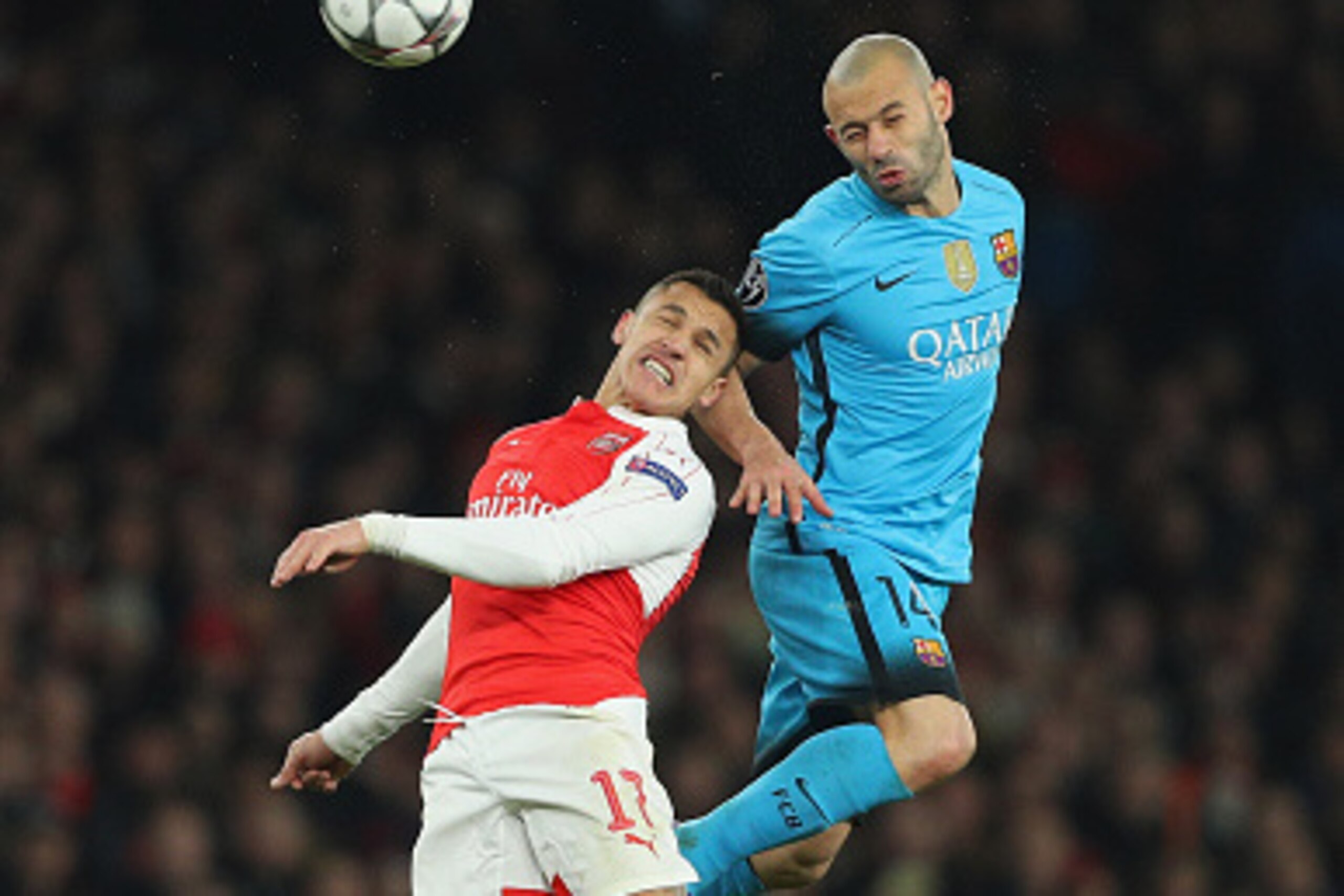 LONDON, ENGLAND - FEBRUARY 23: Javier Mascherano of Barcelona and Alexis Sanchez of Arsenal battle for posession during the UEFA Champions League round of 16 first leg match between Arsenal and Barcelona on February 23, 2016 in London, United Kingdom.  (P