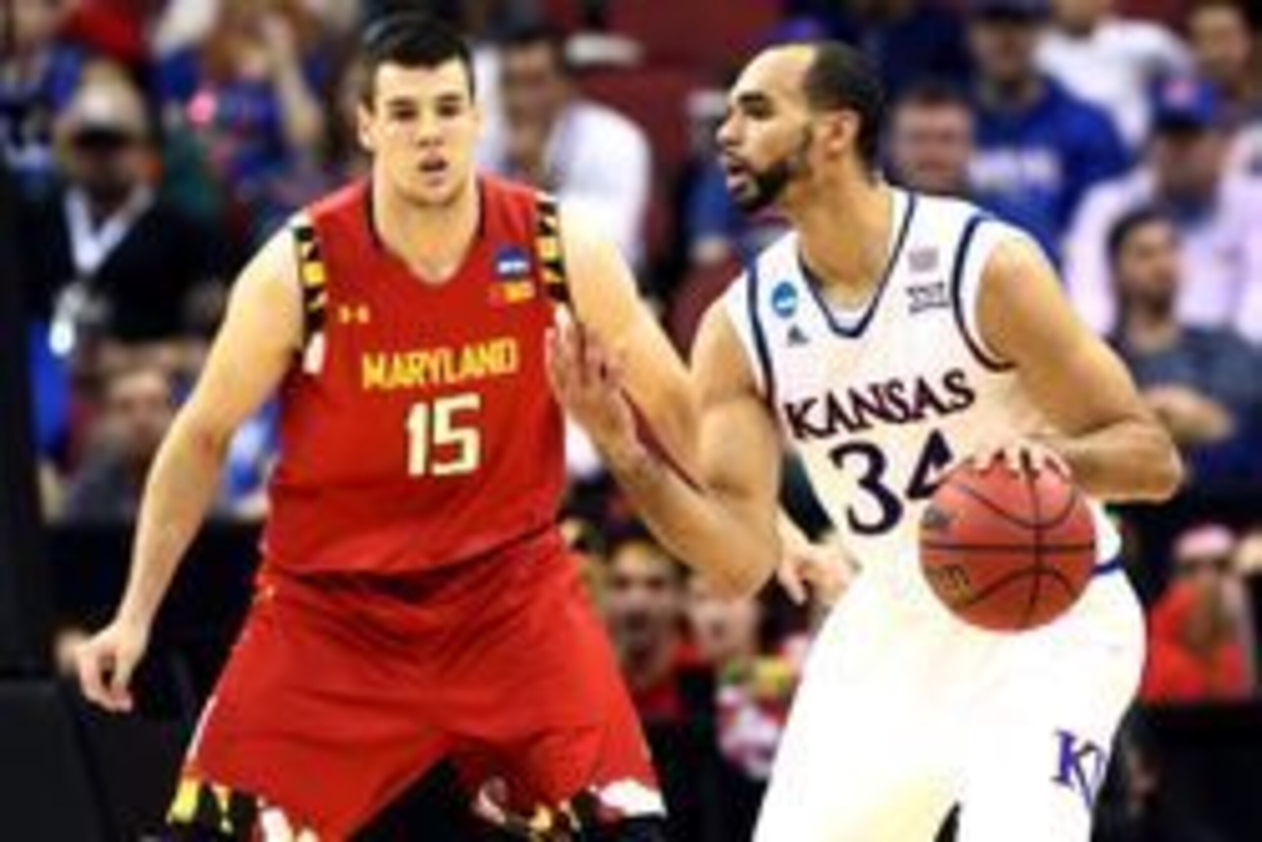 Mar 24, 2016; Louisville, KY, USA; Kansas Jayhawks forward Perry Ellis (34) handles the ball against Maryland Terrapins forward Michal Cekovsky (15) during the first half in a semifinal game in the South regional of the NCAA Tournament at KFC YUM!. Mandat