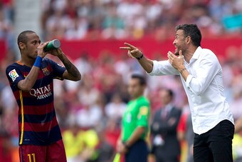 SEVILLE, SPAIN - OCTOBER 03: Head coach Luis Enrique Martinez (R) of FC Barcelona gives instructions to his player Neymar JR. (L) during the La Liga match between Sevilla FC and FC Barcelona at Estadio Ramon Sanchez Pizjuan on October 3, 2015 in Seville, 