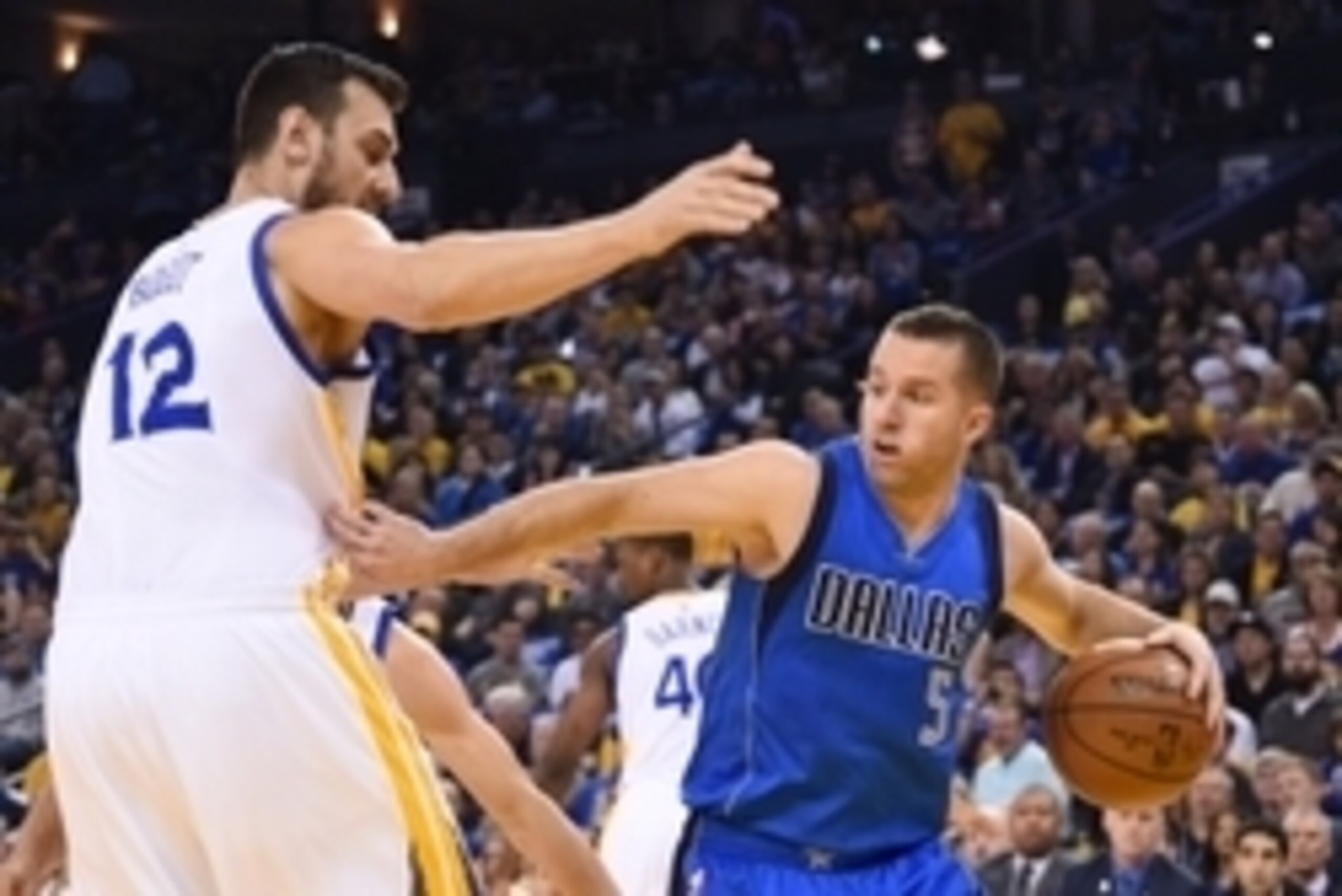 March 25, 2016; Oakland, CA, USA; Dallas Mavericks guard J.J. Barea (5) dribbles the basketball against Golden State Warriors center Andrew Bogut (12) during the first quarter at Oracle Arena. Mandatory Credit: Kyle Terada-USA TODAY Sports March 25, 2016; Oakland, CA, USA; Dallas Mavericks guard J.J. Barea (5) dribbles the basketball against Golden State Warriors center Andrew Bogut (12) during the first quarter at Oracle Arena. Mandatory Credit: Kyle Terada-USA TODAY Sports