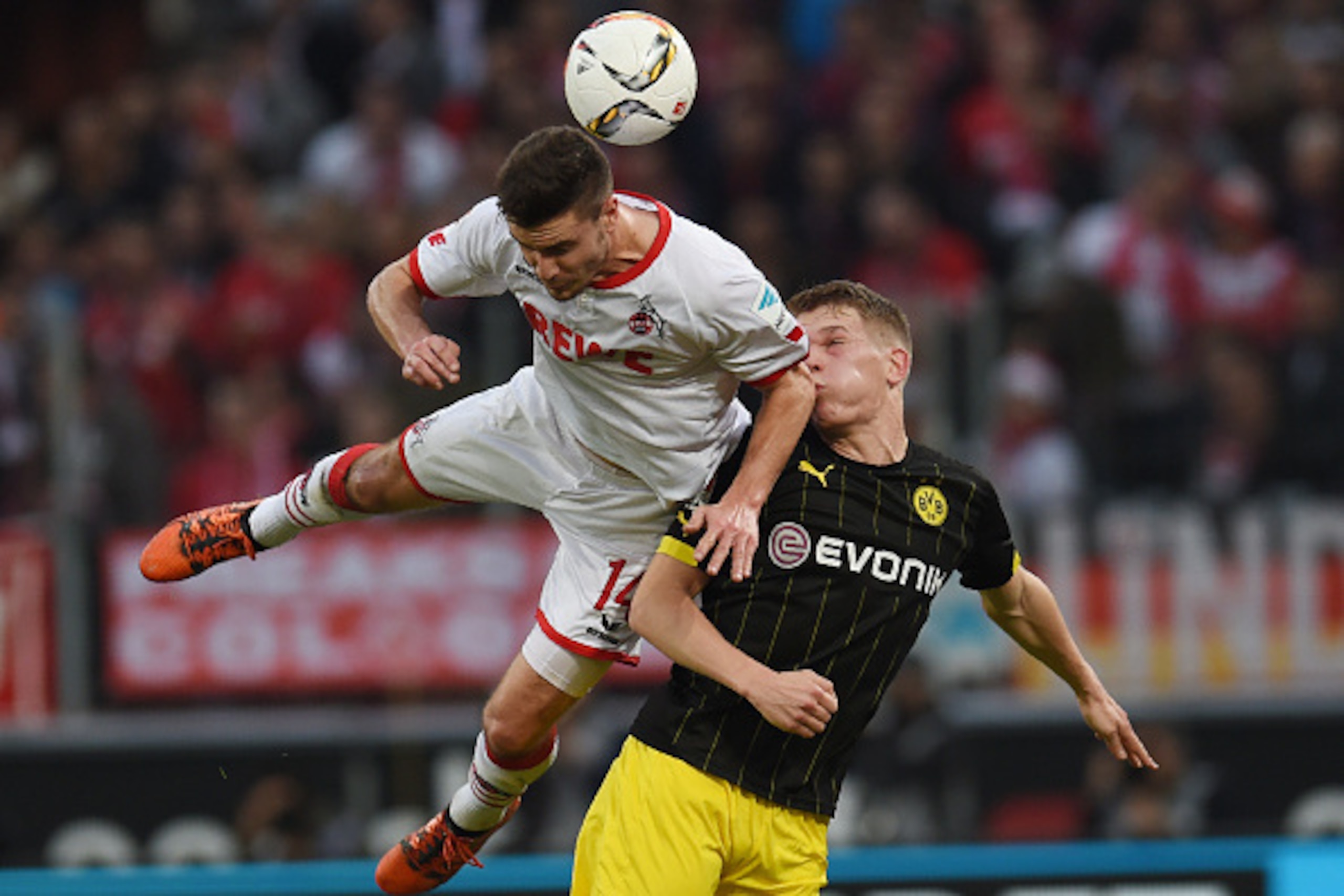 Cologne's defender Jonas Hector (L) vies Dortmund's defender Matthias Ginter during the German first division Bundesliga football match 1 FC Cologne vs Borussia Dortmund in Cologne, western Germany, on December 19, 2015. 

 / AFP / PATRIK STOLLARZ / RESTR
