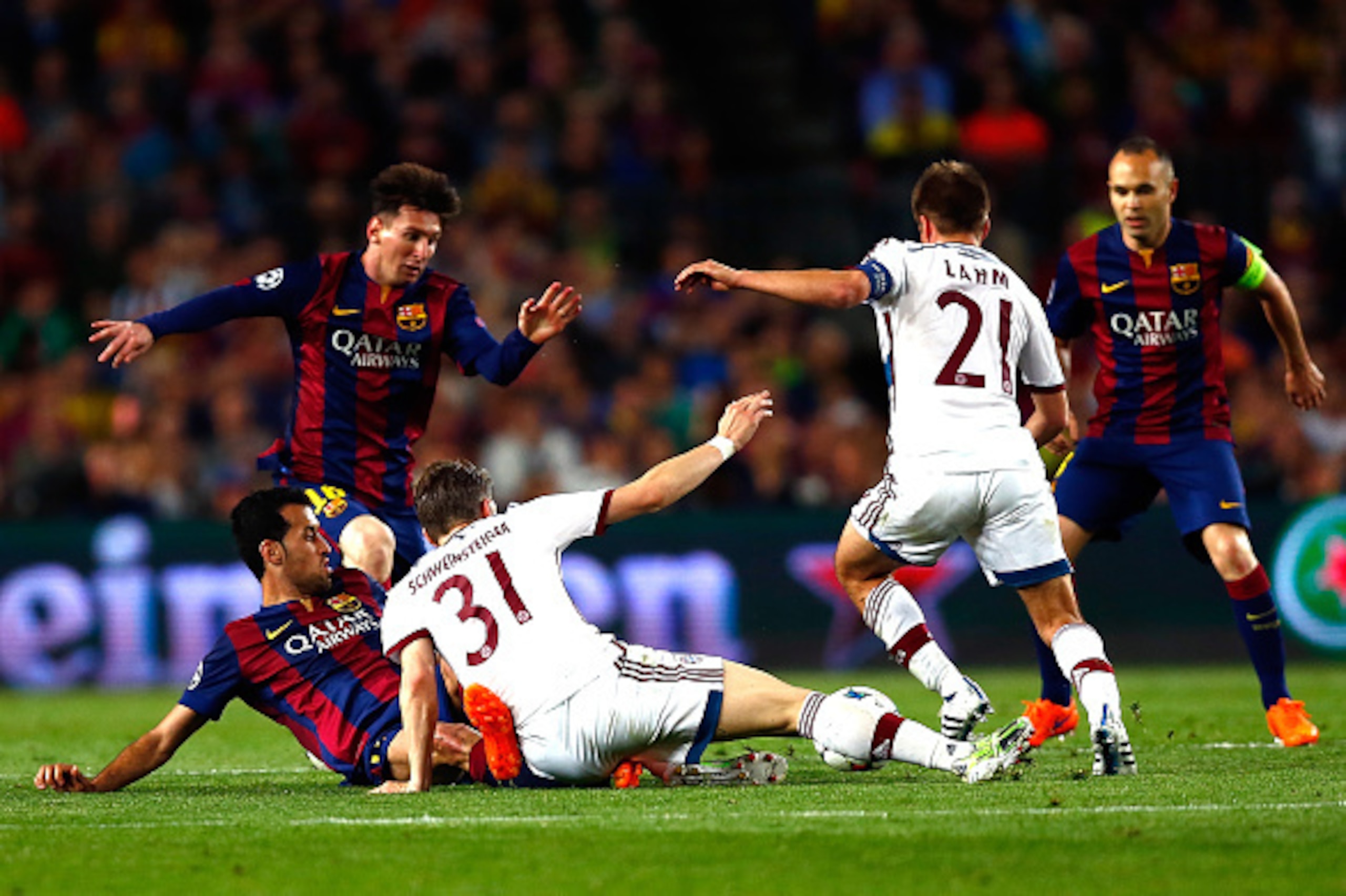 BARCELONA, SPAIN - MAY 06: (L-R) Sergio Busquets and Lionel Messi of Barcelona battle for the ball with Bastian Schweinsteiger and Philipp Lahm of Bayern as Barcelona's Andres Iniesta (R) looks on during the first leg of UEFA Champions League semifinal ma