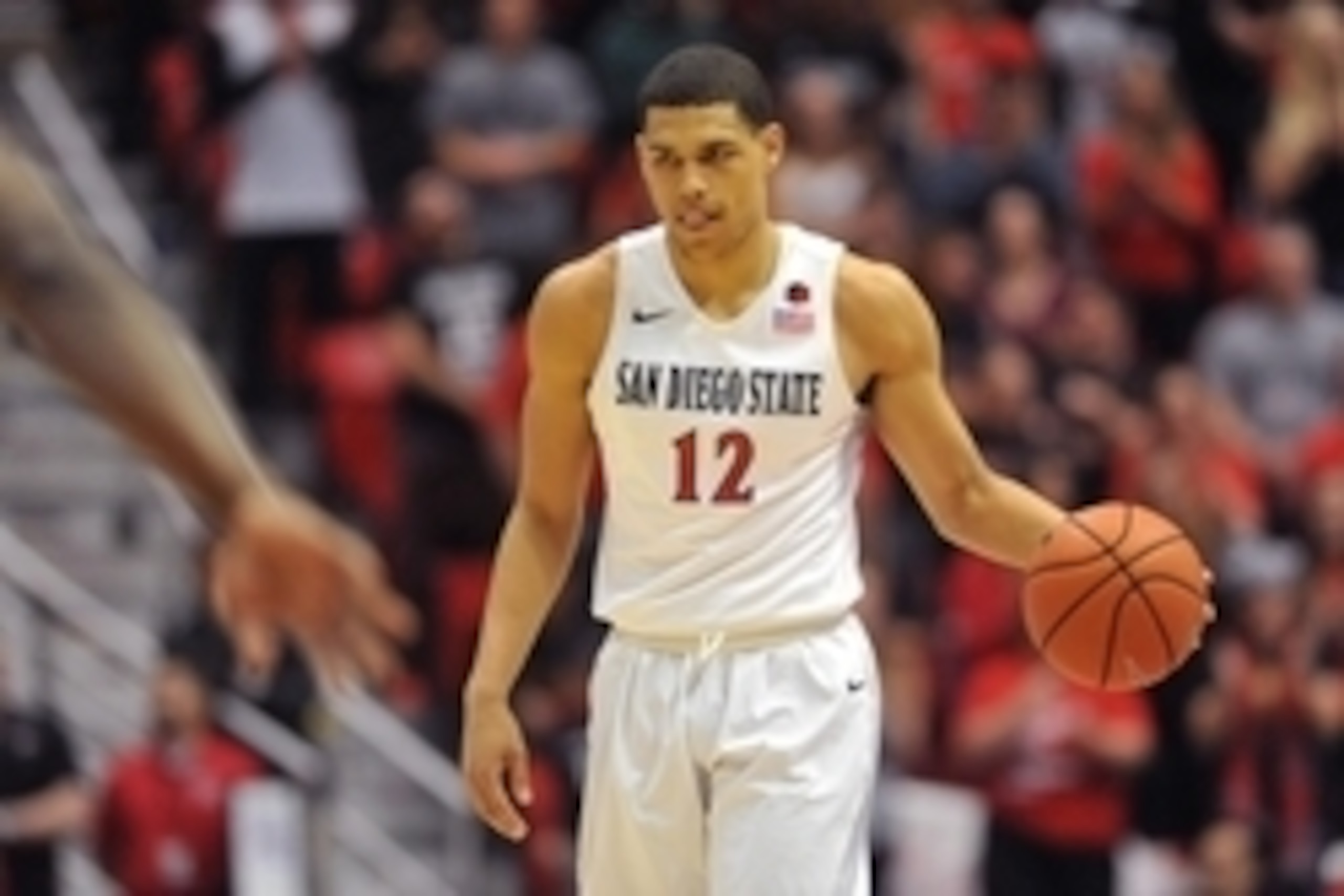 Mar 5, 2016; San Diego, CA, USA; San Diego State Aztecs guard Trey Kell (12) looks downcourt as he dribbles during the game against the UNLV Rebels at Viejas Arena at Aztec Bowl. The Aztecs won 92-56. Mandatory Credit: Orlando Ramirez-USA TODAY Sports