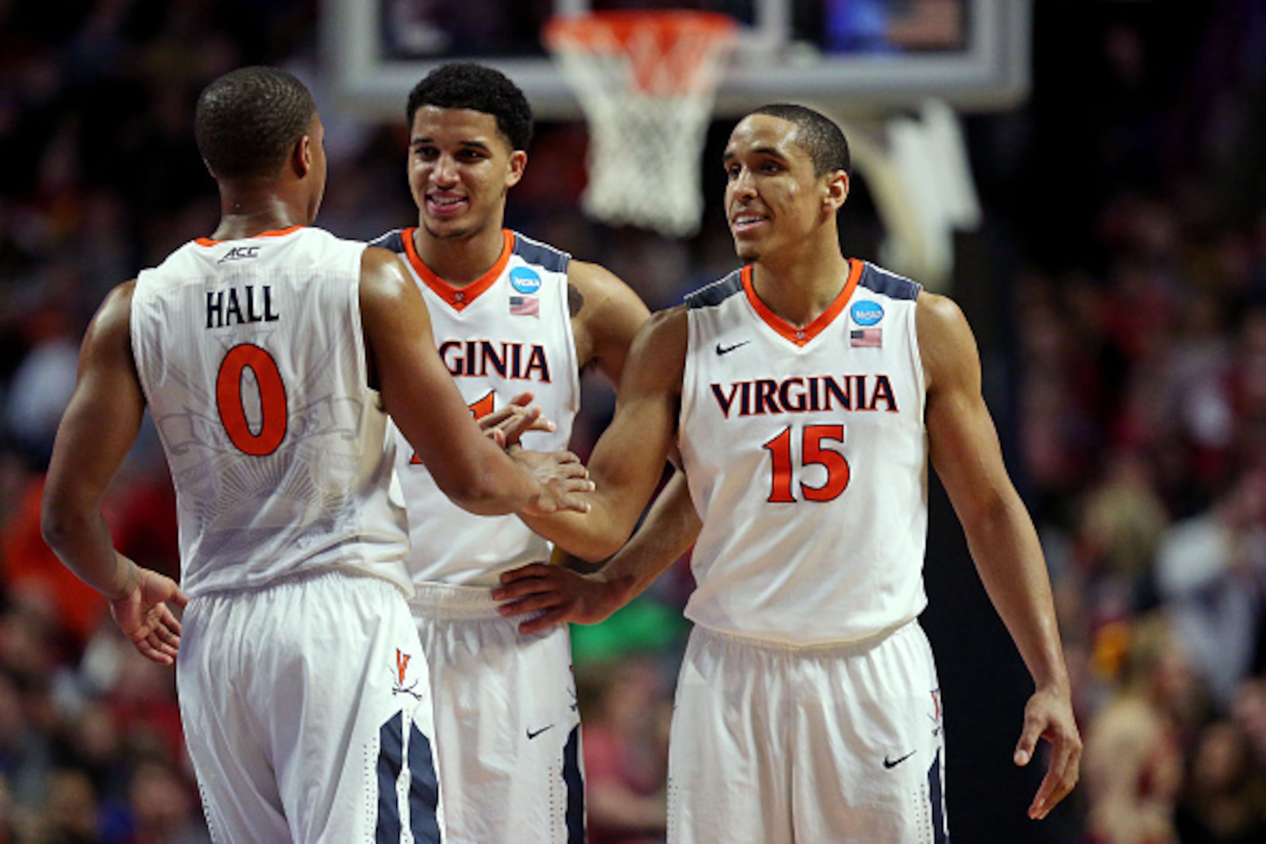 CHICAGO, IL - MARCH 25: Isaiah Wilkins #21, Devon Hall #0 and Malcolm Brogdon #15 of the Virginia Cavaliers celebrate in the second half against the Iowa State Cyclones during the 2016 NCAA Men's Basketball Tournament Midwest Regional at United Center on CHICAGO, IL - MARCH 25: Isaiah Wilkins #21, Devon Hall #0 and Malcolm Brogdon #15 of the Virginia Cavaliers celebrate in the second half against the Iowa State Cyclones during the 2016 NCAA Men's Basketball Tournament Midwest Regional at United Center on