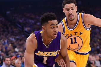 OAKLAND, CA - NOVEMBER 24:  D'Angelo Russell #1 of the Los Angeles Lakers dribbles past Klay Thompson #11 of the Golden State Warriors during their NBA basketball game at ORACLE Arena on November 24, 2015 in Oakland, California. NOTE TO USER: User express
