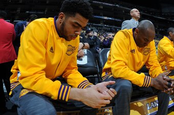 LOS ANGELES, CA - MARCH 25: D'Angelo Russell #1 and Kobe Bryant #24 of the Los Angeles Lakers before the game against the Denver Nuggets on March 25, 2016 at STAPLES Center in Los Angeles, California. NOTE TO USER: User expressly acknowledges and agrees t