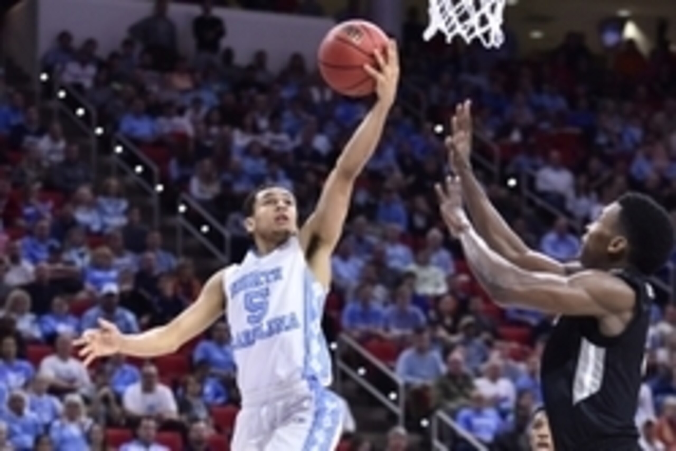 Mar 19, 2016; Raleigh, NC, USA; North Carolina Tar Heels guard Marcus Paige (5) shoots the ball over Providence Friars forward Rodney Bullock (5) in the second half during the second round of the 2016 NCAA Tournament at PNC Arena. Mandatory Credit: Bob Do