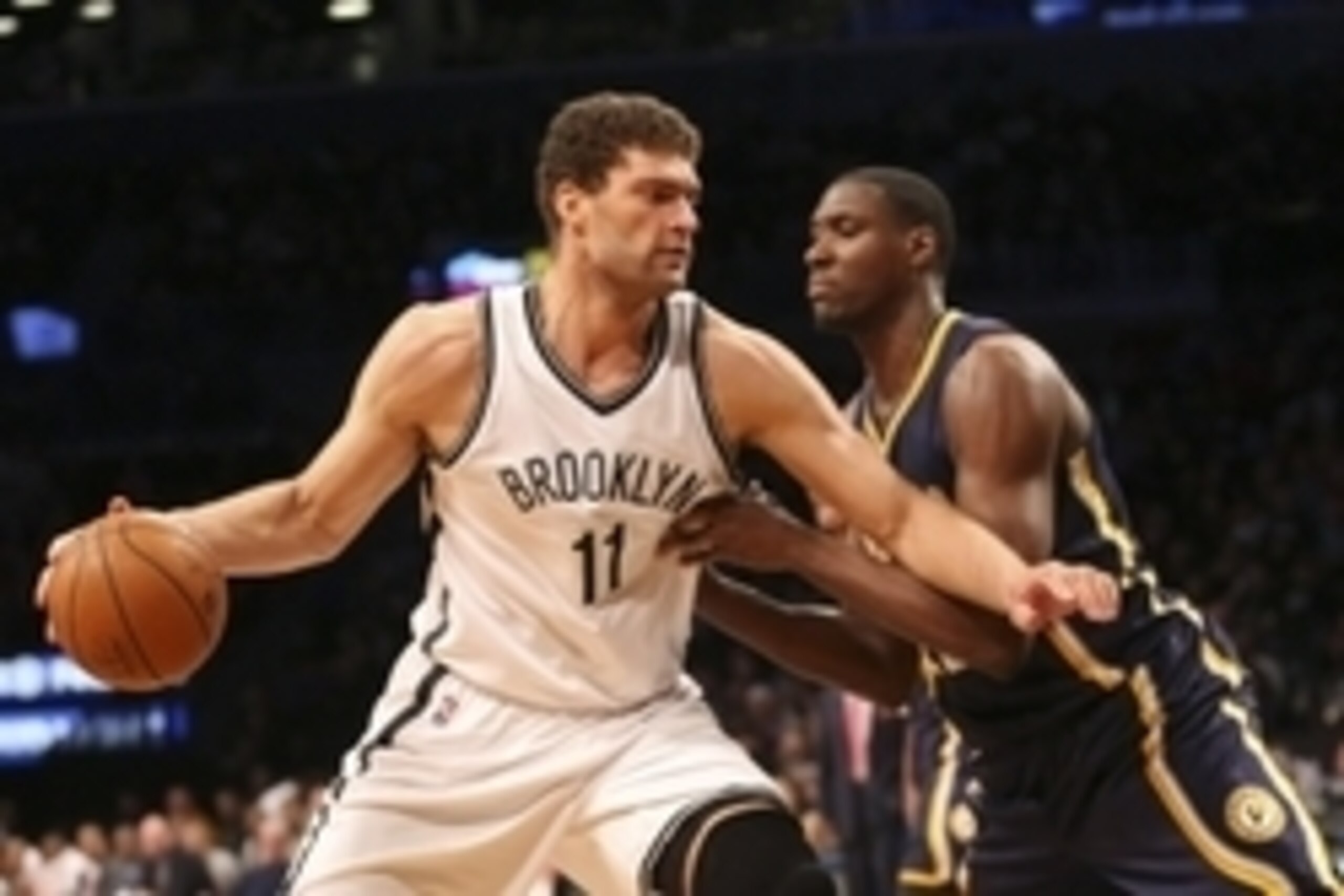 Mar 26, 2016; Brooklyn, NY, USA;  Brooklyn Nets center Brook Lopez (11) drives against Indiana Pacers center Ian Mahinmi (28) during the third quarter at Barclays Center. Brooklyn Nets won 120-110. Mandatory Credit: Anthony Gruppuso-USA TODAY Sports