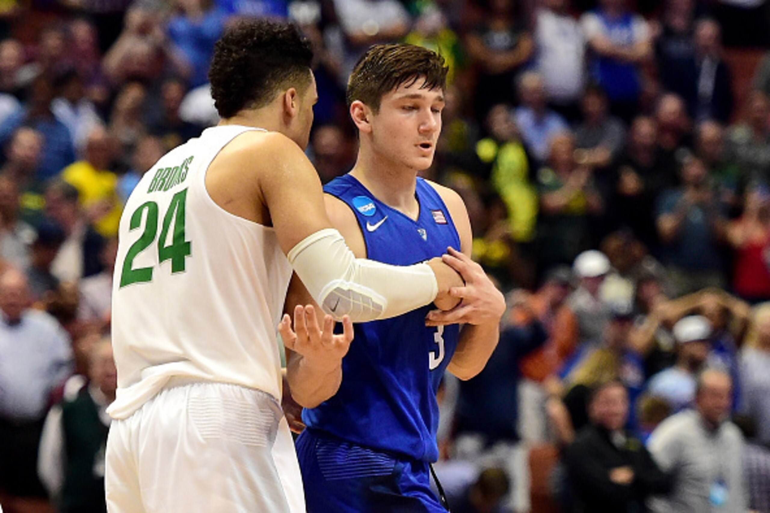 ANAHEIM, CA - MARCH 24:  Grayson Allen #3 of the Duke Blue Devils is hugged by Dillon Brooks #24 of the Oregon Ducks after losing 82-68 to the Ducks in the 2016 NCAA Men's Basketball Tournament West Regional at the Honda Center on March 24, 2016 in Anahei