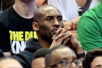 ANAHEIM, CA - MARCH 26:  Kobe Bryant of the Los Angeles Lakers watches the NCAA Men's Basketball Tournament West Regional Final at Honda Center on March 26, 2016 in Anaheim, California.  (Photo by Harry How/Getty Images)