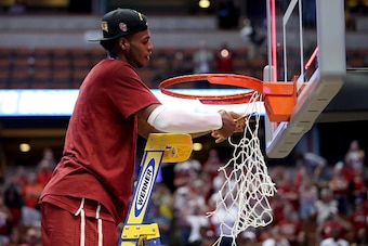 ANAHEIM, CA - MARCH 26:  Buddy Hield #24 of the Oklahoma Sooners cuts down a piece of the net after the Sooners 80-68 victory against the Oregon Ducks in the NCAA Men's Basketball Tournament West Regional Final at Honda Center on March 26, 2016 in Anaheim
