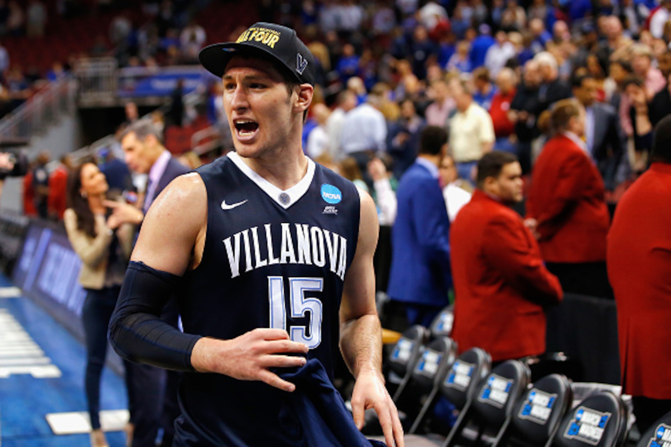 LOUISVILLE, KY - MARCH 26:  Ryan Arcidiacono #15 of the Villanova Wildcats celebrates defeating the Kansas Jayhawks 64-59 during the 2016 NCAA Men's Basketball Tournament South Regional at KFC YUM! Center on March 26, 2016 in Louisville, Kentucky.  (Photo