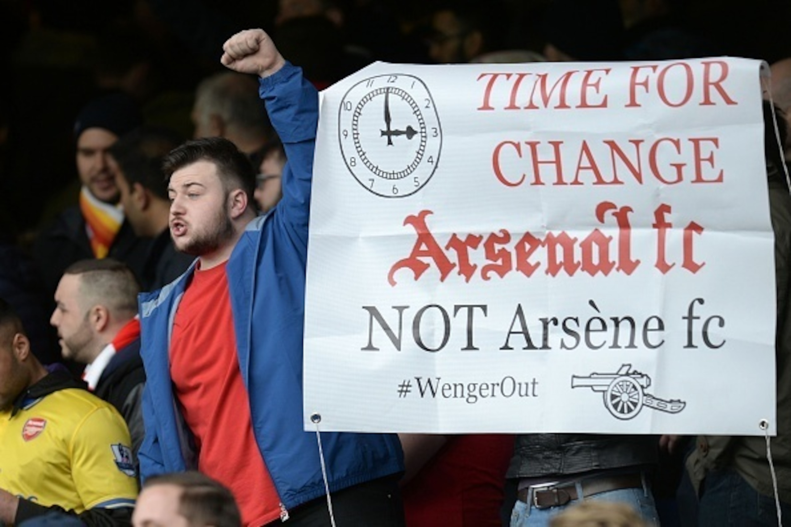 An anti-Arsene Wenger banner is displayed by the Arsenal fans after the English Premier League football match between Everton and Arsenal at Goodison Park in Liverpool, north west England on March 19, 2016.  
Arsenal won the game 2-0. / AFP / OLI SCARFF /