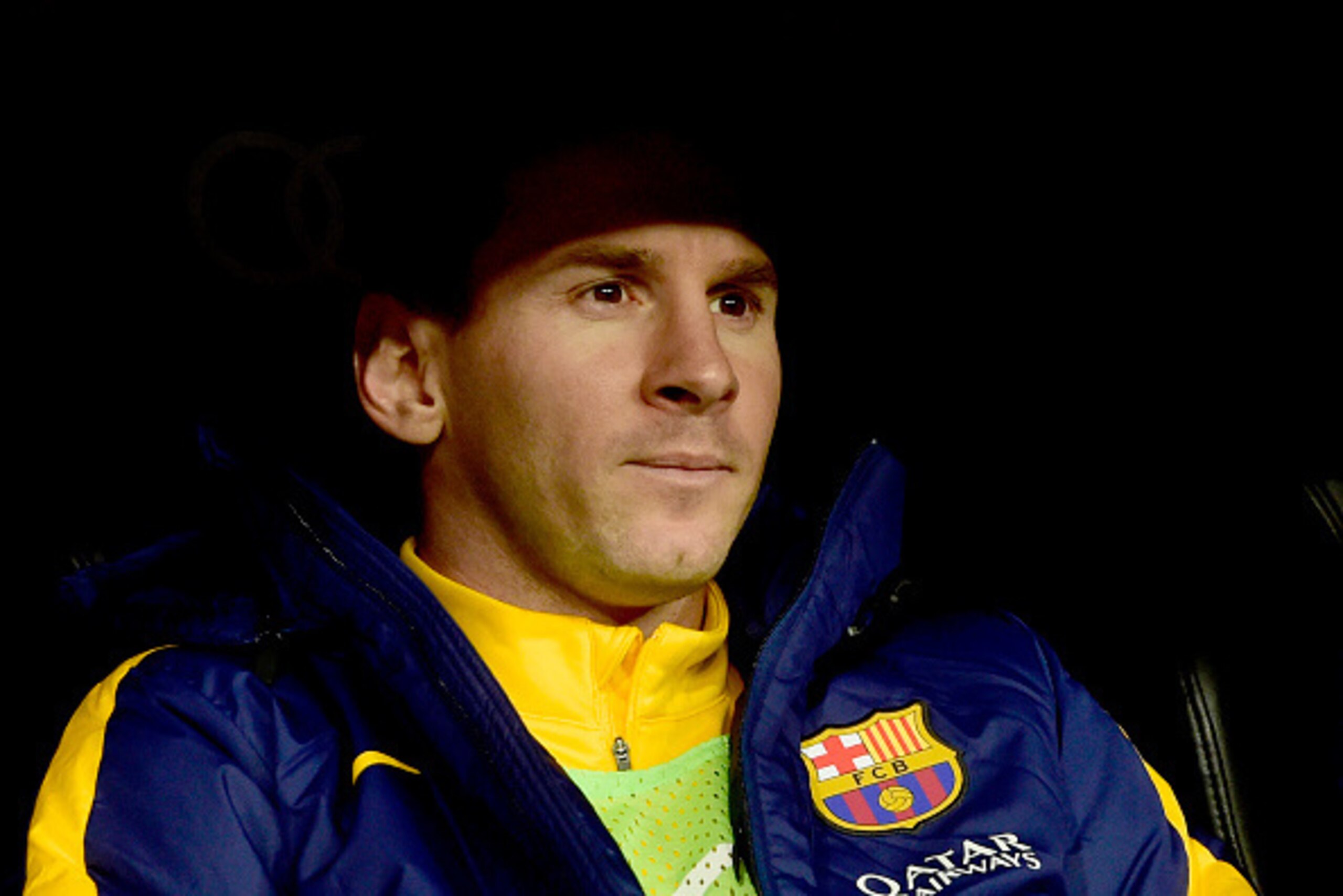 Barcelona's Argentinian forward Lionel Messi sits on the bench during the Spanish league 'Clasico' football match Real Madrid CF vs FC Barcelona at the Santiago Bernabeu stadium in Madrid on November 21, 2015.   / AFP / PIERRE-PHILIPPE MARCOU        (Phot