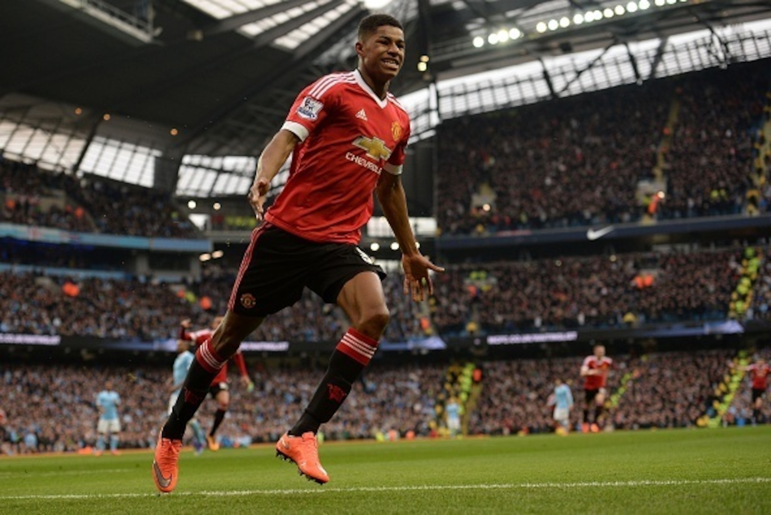 Manchester United's English striker Marcus Rashford celebrates scoring his team's first goal during the English Premier League football match between Manchester City and Manchester United at the Etihad Stadium in Manchester, north west England, on March 2