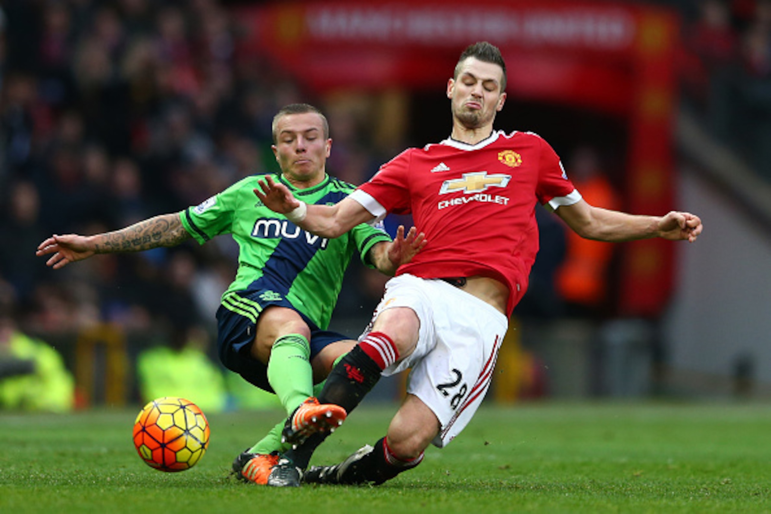 MANCHESTER, ENGLAND - JANUARY 23:  Morgan Schneiderlin of Manchester United and Jordy Clasie of Southampton compete for the ball during the Barclays Premier League match between Manchester United and Southampton at Old Trafford on January 23, 2016 in Manc