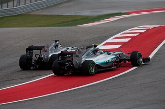 AUSTIN, TX - OCTOBER 25:  Lewis Hamilton of Great Britain overtakes Nico Rosberg of Germany both of Mercedes at the start during the United States Formula One Grand Prix at Circuit of The Americas on October 25, 2015 in Austin, United States.  (Photo by P