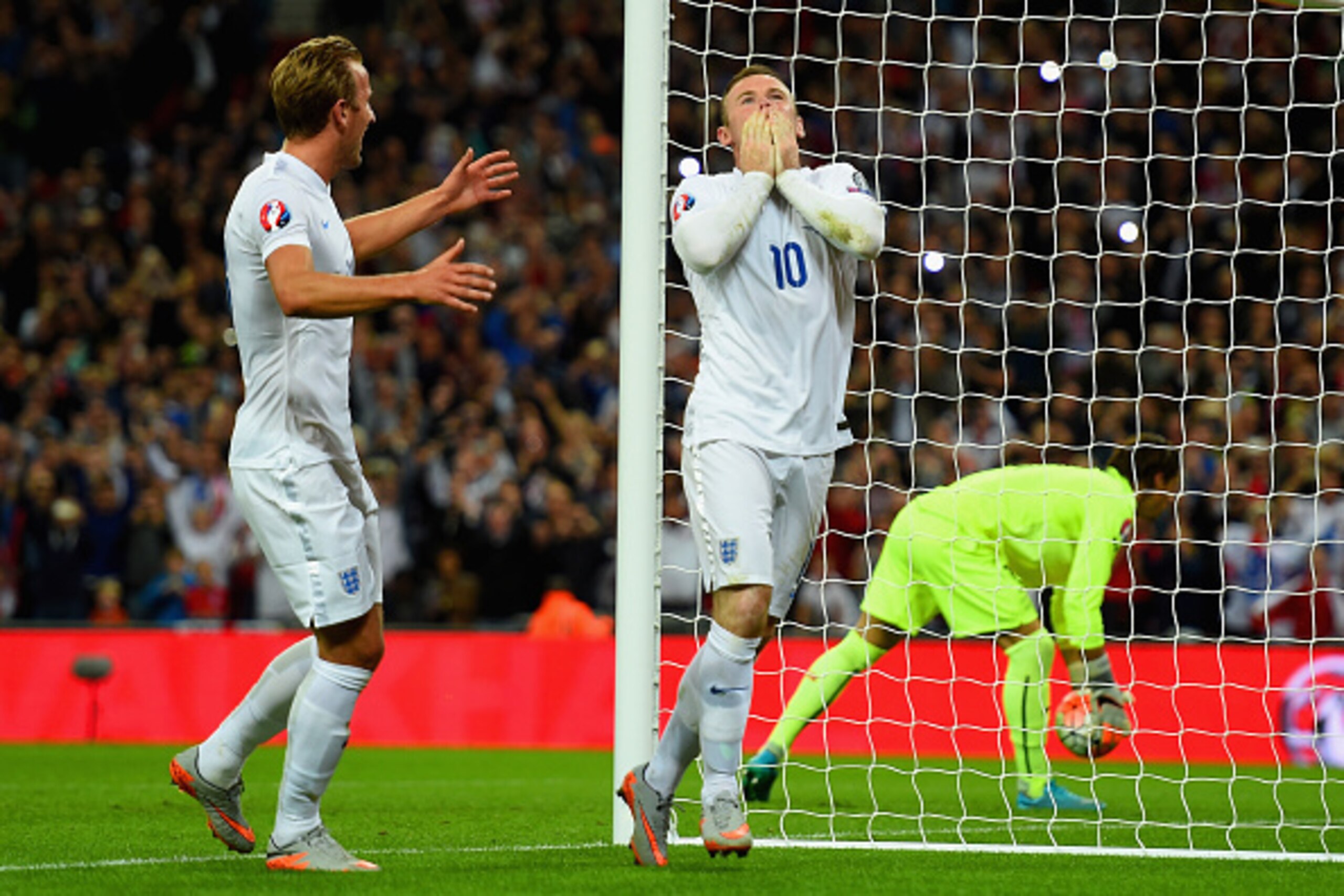 LONDON, ENGLAND - SEPTEMBER 08:  Wayne Rooney of England celebrates scoring their second goal from the penalty spot with Harry Kane of England during the UEFA EURO 2016 Group E qualifying match between England and Switzerland at Wembley Stadium on Septemb