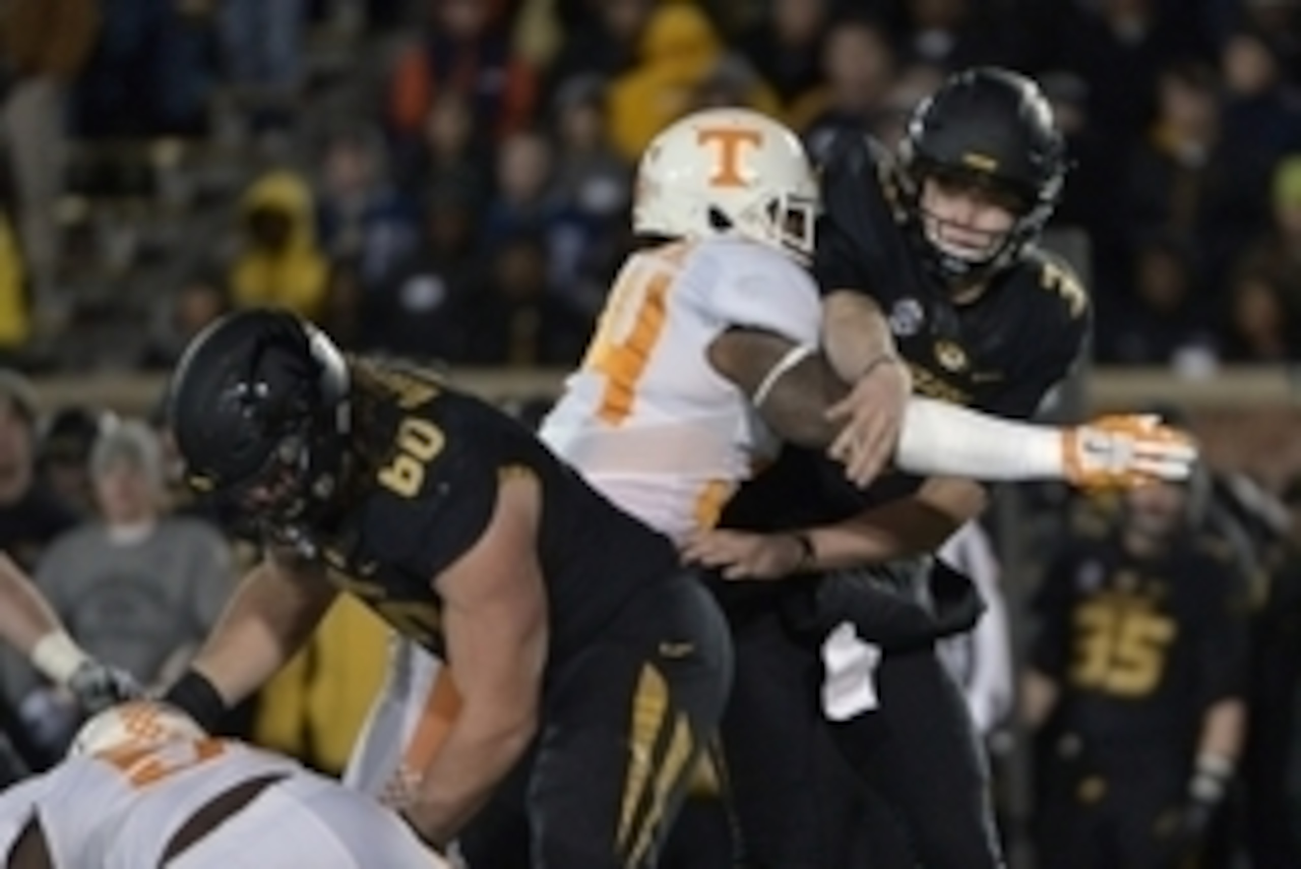 Nov 21, 2015; Columbia, MO, USA; Missouri Tigers quarterback Drew Lock (3) is hit by Tennessee Volunteers linebacker Darrin Kirkland Jr. (34) while throwing during the first half at Faurot Field. Mandatory Credit: Denny Medley-USA TODAY Sports Nov 21, 2015; Columbia, MO, USA; Missouri Tigers quarterback Drew Lock (3) is hit by Tennessee Volunteers linebacker Darrin Kirkland Jr. (34) while throwing during the first half at Faurot Field. Mandatory Credit: Denny Medley-USA TODAY Sports