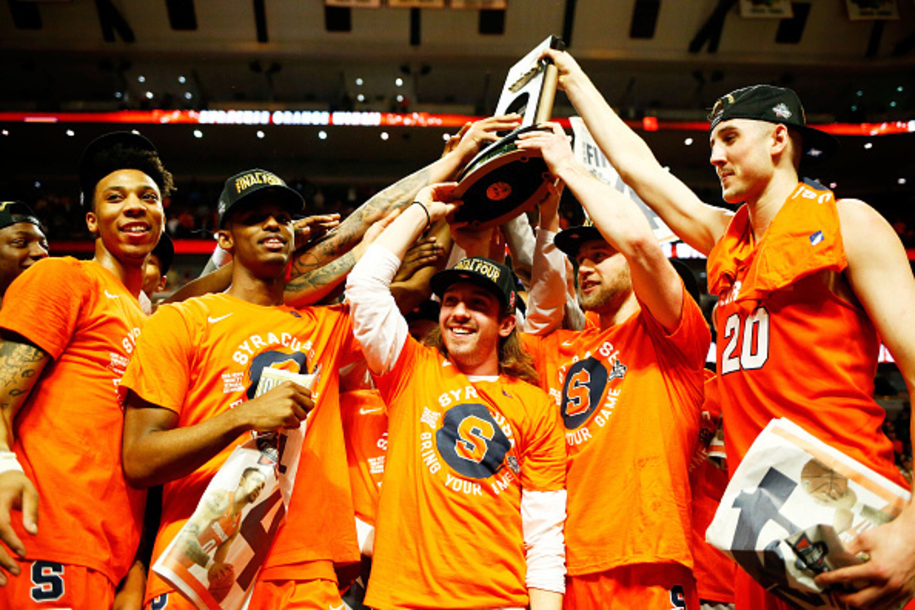CHICAGO, IL - MARCH 27:  The Syracuse Orange celebrate their 68 to 62 win over the Virginia Cavaliers with teammates during the 2016 NCAA Men's Basketball Tournament Midwest Regional Final at United Center on March 27, 2016 in Chicago, Illinois.  (Photo b