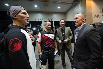 LAS VEGAS, NV - MARCH 5:   (R-L) Nordine Taleb and UFC welterweight Georges St-Pierre talk backstage during the UFC 196 in the MGM Grand Garden Arena on March 5, 2016 in Las Vegas, Nevada. (Photo by Brandon Magnus/Zuffa LLC/Zuffa LLC via Getty Images)