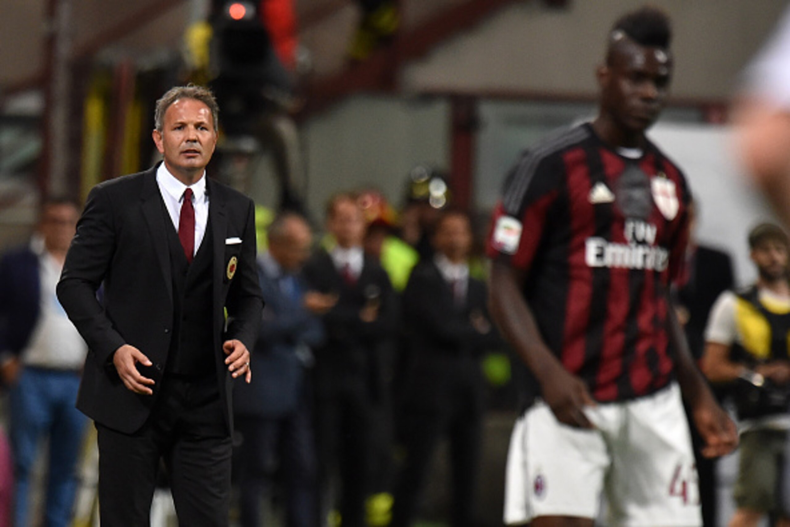 MILAN, ITALY - SEPTEMBER 19:  Head Coach Sinisa Mihajlovic of Milan and  Mario Balotelli look on during the Serie A match between AC Milan and US Citta di Palermo at Stadio Giuseppe Meazza on September 19, 2015 in Milan, Italy.  (Photo by Tullio M. Puglia