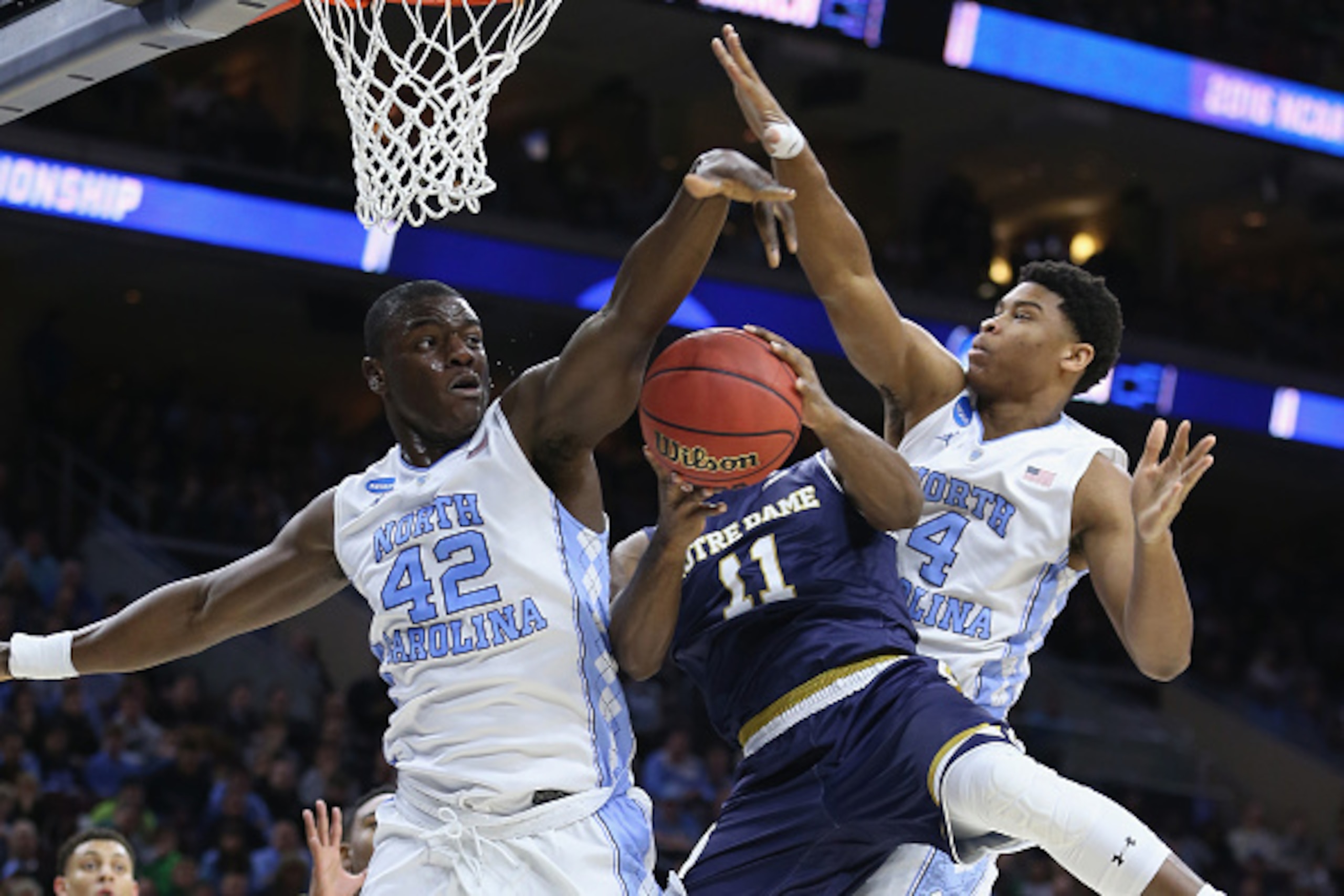 PHILADELPHIA, PA - MARCH 27: Isaiah Hicks #4 and Joel James #42 of the North Carolina Tar Heels block a shot by Demetrius Jackson #11 of the Notre Dame Fighting Irish in the first half during the 2016 NCAA Men's Basketball Tournament East Regional Final PHILADELPHIA, PA - MARCH 27: Isaiah Hicks #4 and Joel James #42 of the North Carolina Tar Heels block a shot by Demetrius Jackson #11 of the Notre Dame Fighting Irish in the first half during the 2016 NCAA Men's Basketball Tournament East Regional Final