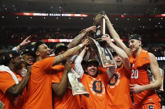 CHICAGO, IL - MARCH 27:  The Syracuse Orange celebrate their 68 to 62 win over the Virginia Cavaliers with teammates during the 2016 NCAA Men's Basketball Tournament Midwest Regional Final at United Center on March 27, 2016 in Chicago, Illinois.  (Photo b