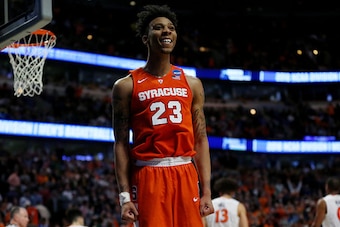 CHICAGO, IL - MARCH 27:  Malachi Richardson #23 of the Syracuse Orange celebrates their 68 to 62 win over the Virginia Cavaliers with teammates during the 2016 NCAA Men's Basketball Tournament Midwest Regional Final at United Center on March 27, 2016 in C