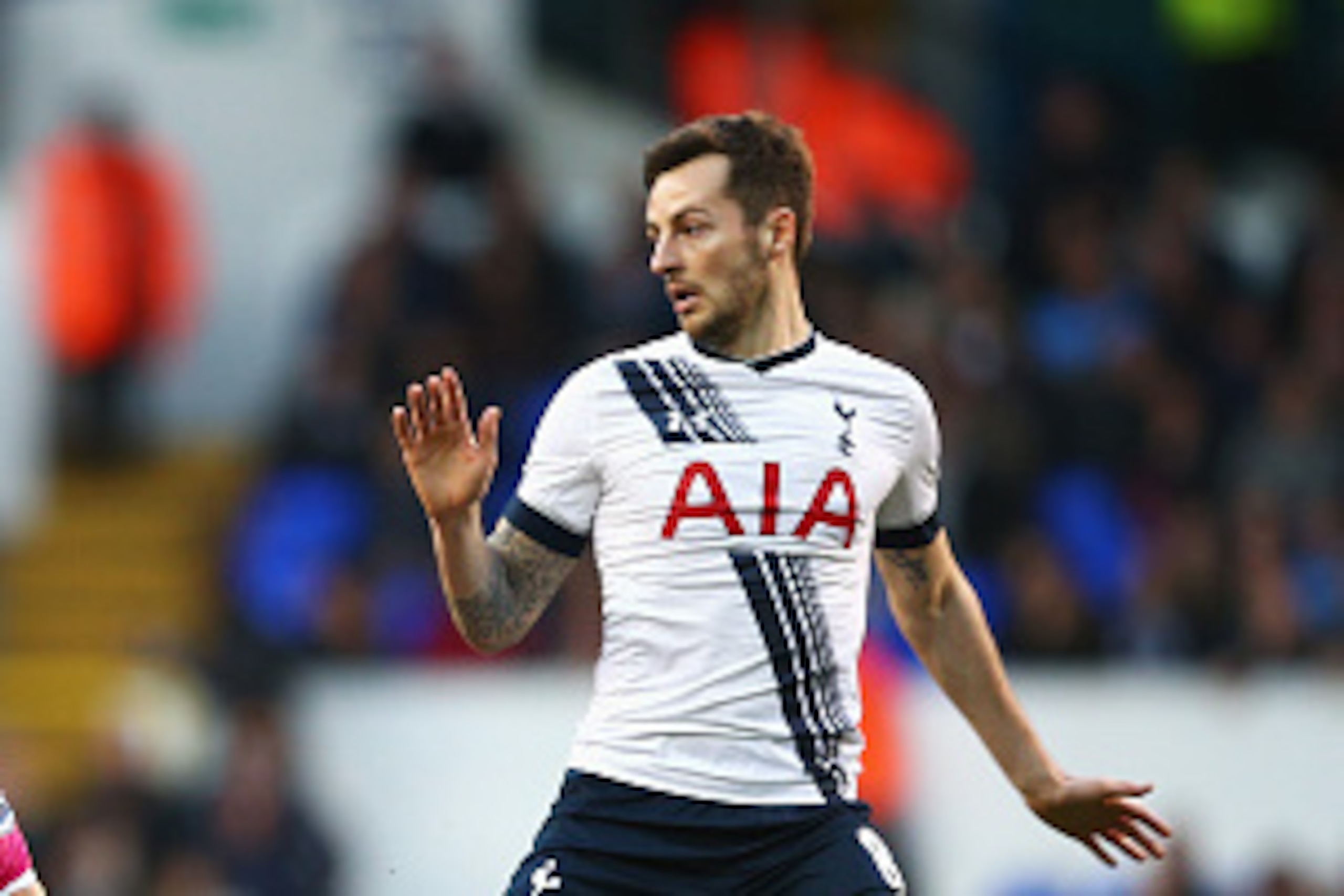 LONDON, ENGLAND - MARCH 20:  Marc Pugh of Bournemouth is challenged by Ryan Mason of Tottenham Hotspur during the Barclays Premier League match between Tottenham Hotspur and A.F.C. Bournemouth at White Hart Lane on March 20, 2016 in London, United Kingdom