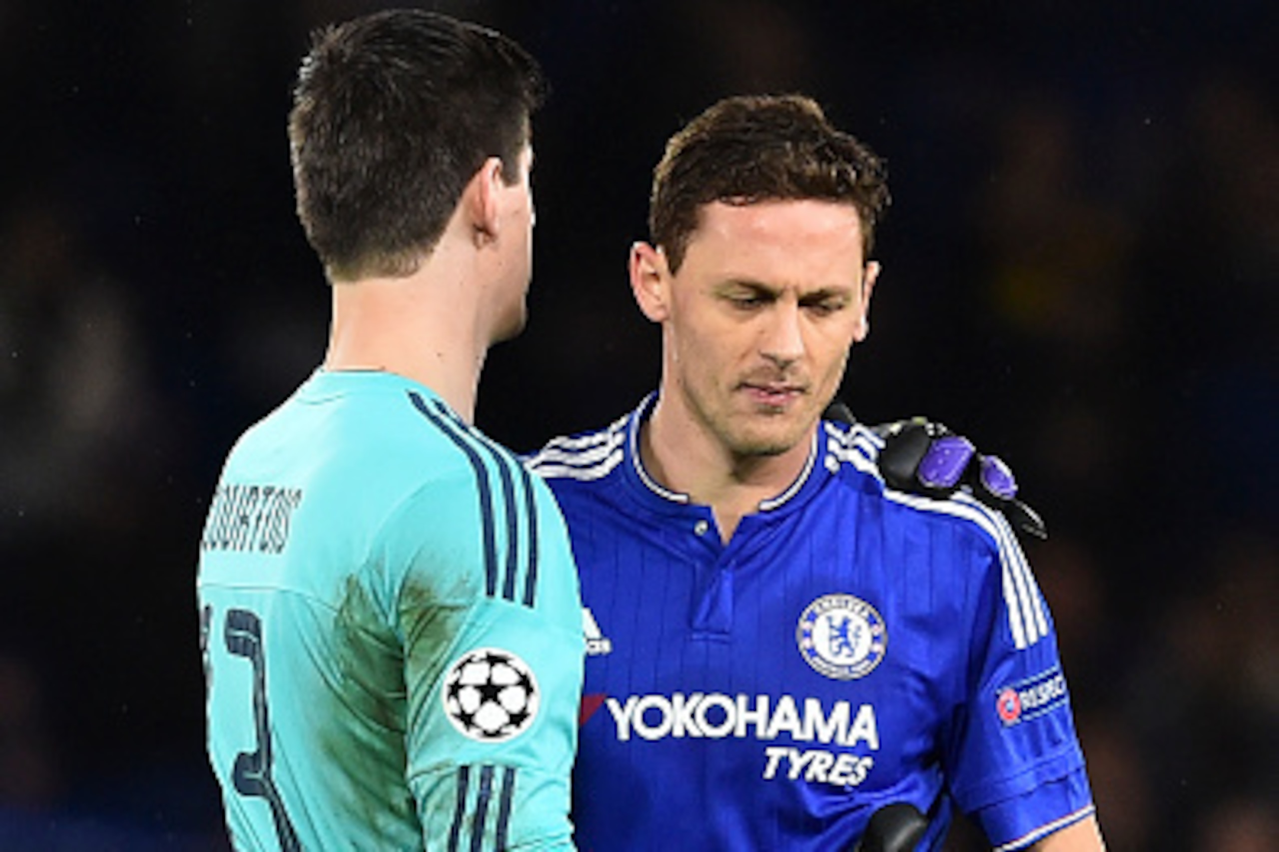 Chelsea's Serbian midfielder Nemanja Matic (R) emrbaces Chelsea's Belgian goalkeeper Thibaut Courtois (L) at the end of the UEFA Champions League Group G football match between Chelsea and Porto at Stamford Bridge in London on December 9, 2015.  AFP PHOTO