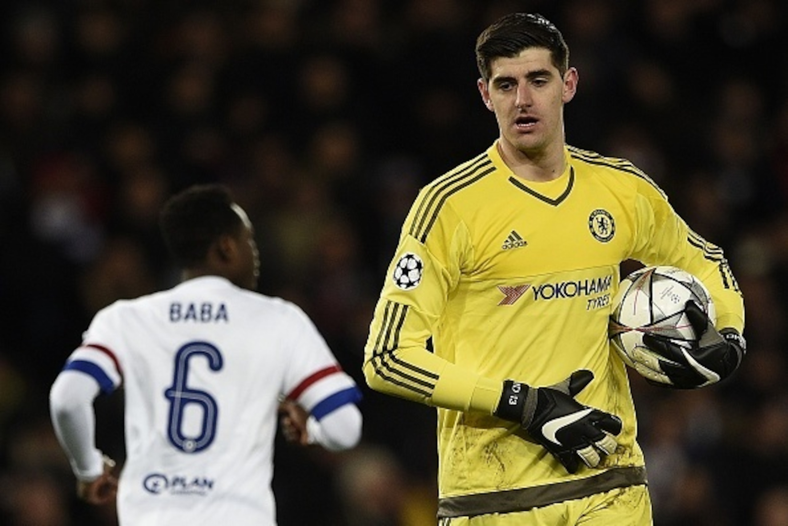 Chelsea's Belgian goalkeeper Thibaut Courtois (R) holds the ball next to Chelsea's Ghanaian defender Abdul Rahman Baba  during the Champions League round of 16 first leg football match between Paris Saint-Germain (PSG) and Chelsea FC on February 16, 2016,