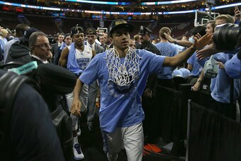 PHILADELPHIA, PA - MARCH 27:  Marcus Paige #5 of the North Carolina Tar Heels celebrates after defeating the Notre Dame Fighting Irish with a score of 74 to 88 in the 2016 NCAA Men's Basketball Tournament East Regional Final at Wells Fargo Center on March