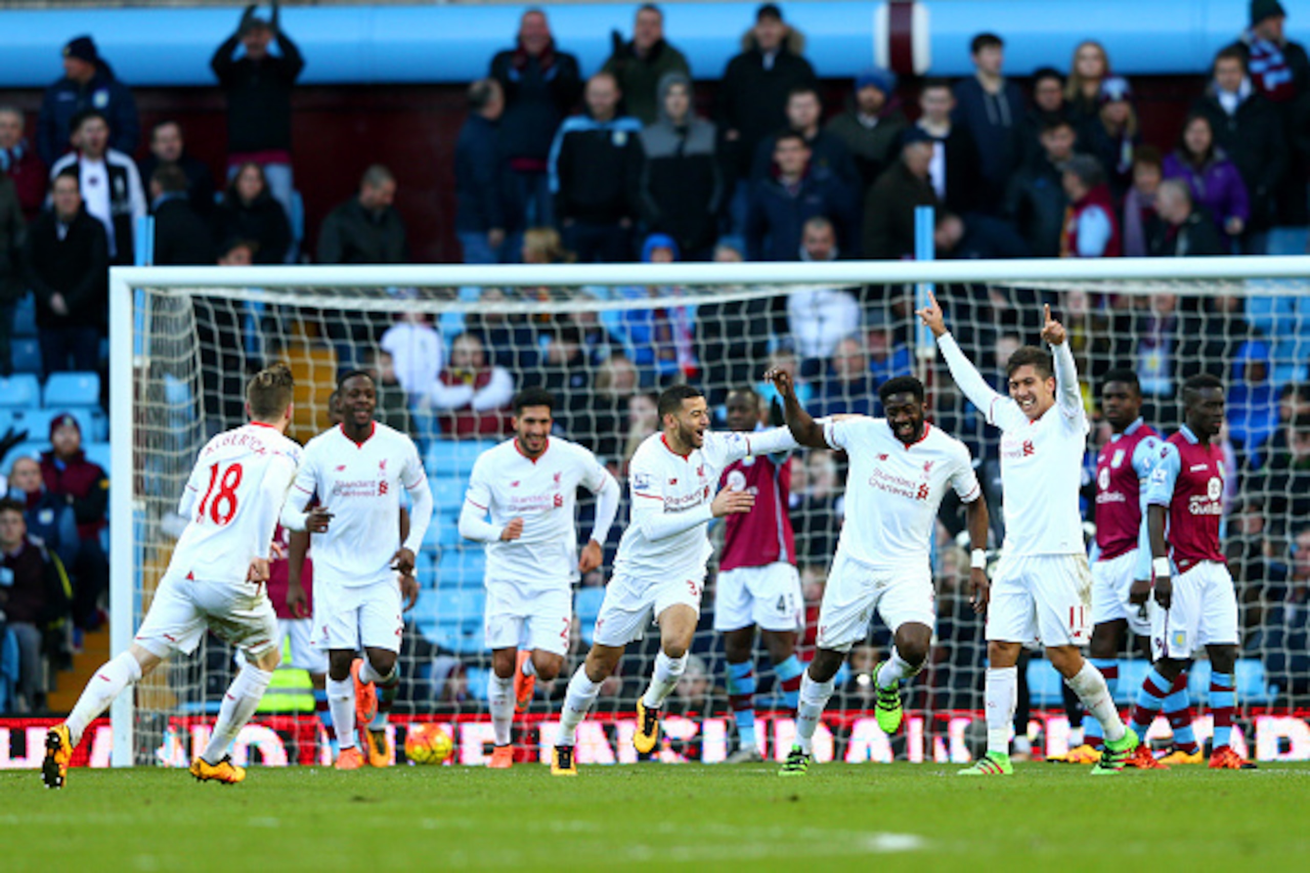 BIRMINGHAM, ENGLAND - FEBRUARY 14:  Kolo Toure of Liverpool celebrates with team-mates after scoring his team's sixth goal during the Barclays Premier League match between Aston Villa and Liverpool at Villa Park on February 14, 2016 in Birmingham, England